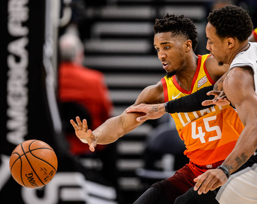 (Trent Nelson | The Salt Lake Tribune) Utah Jazz guard Donovan Mitchell (45) chases down the ball ahead of San Antonio Spurs guard DeMar DeRozan (10) as the Utah Jazz host the San Antonio Spurs, NBA basketball in Salt Lake City on Saturday Feb. 9, 2019.