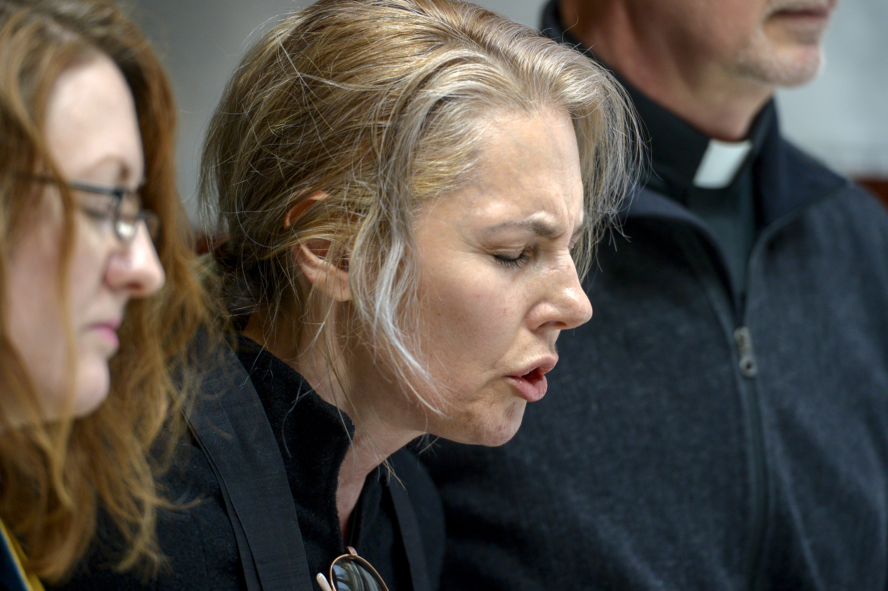 Leah Hogsten | The Salt Lake Tribune Zen Buddhist Anna Zumwalt chants with faith leaders in opposition to SB96 outside the Utah House chambers, Feb. 8, 2019. 