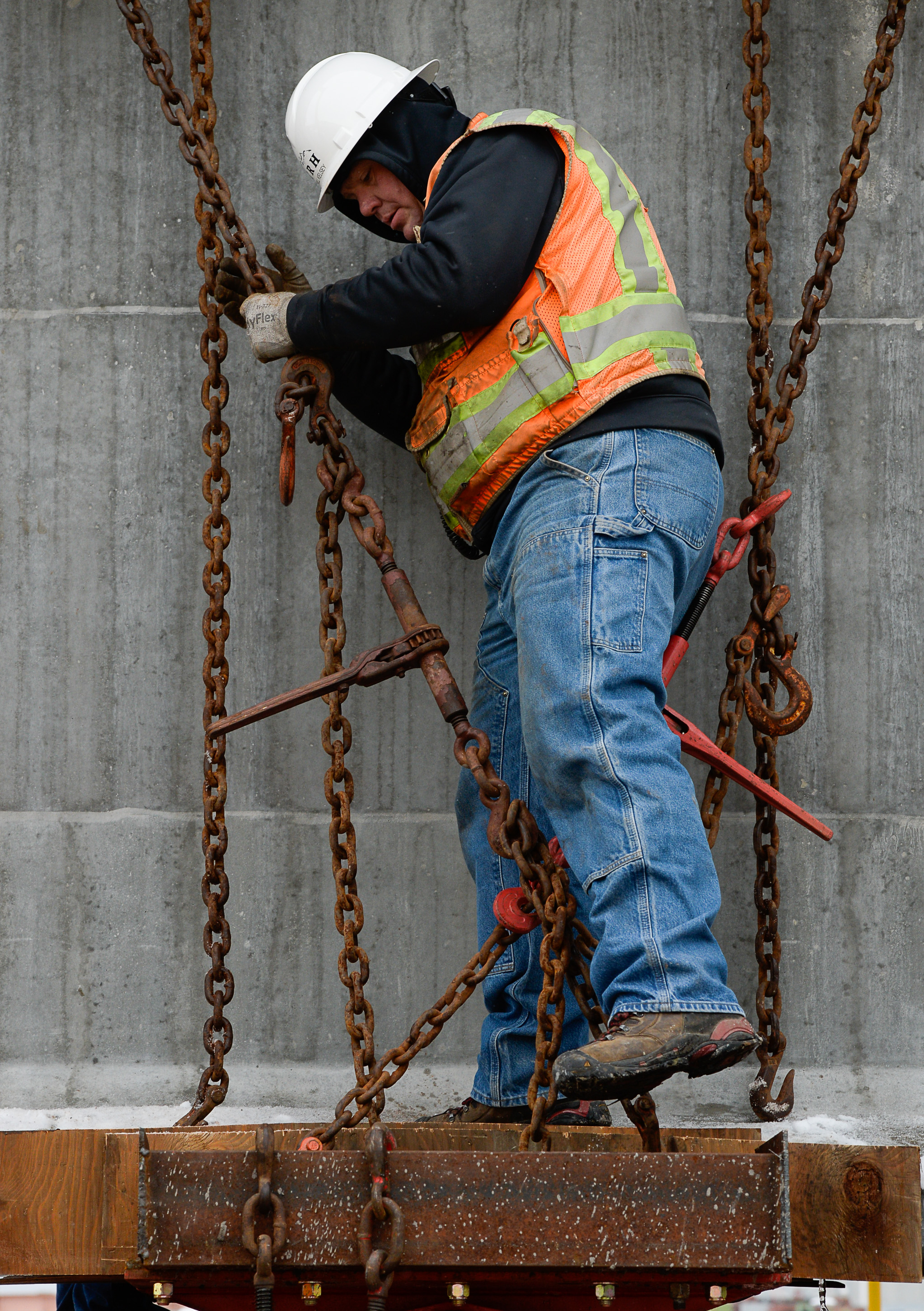 (Francisco Kjolseth | The Salt Lake Tribune) UDOT gets ready to place some of the world's largest-ever bridge beams, and the largest in Utah state history with a span of 203 ft long and just over 8 ft tall, as crews load one on a truck following manufacturing at Forterra Structural Precast in Kearns on Tuesday, Dec. 11, 2018. A total of six beams will be installed in the technology corridor in Lehi later this week.