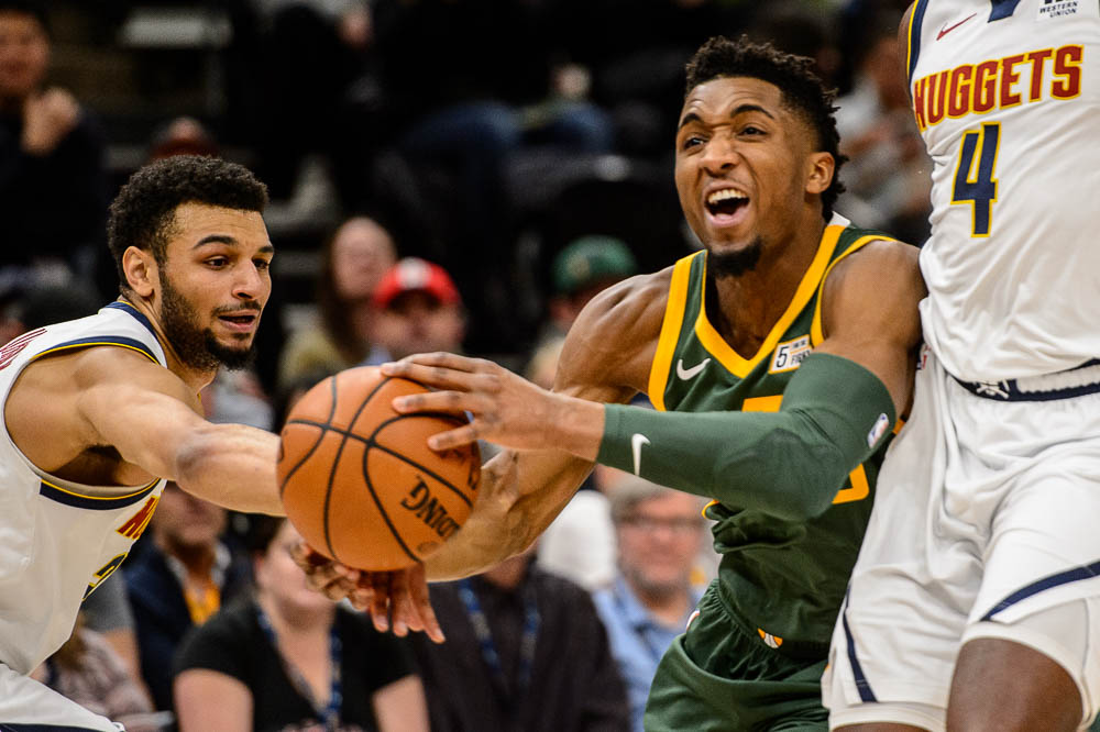 (Trent Nelson | The Salt Lake Tribune) Denver Nuggets guard Jamal Murray (27) reaches in on Utah Jazz guard Donovan Mitchell (45) as the Utah Jazz host the Denver Nuggets, NBA basketball in Salt Lake City on Wednesday Jan. 23, 2019.