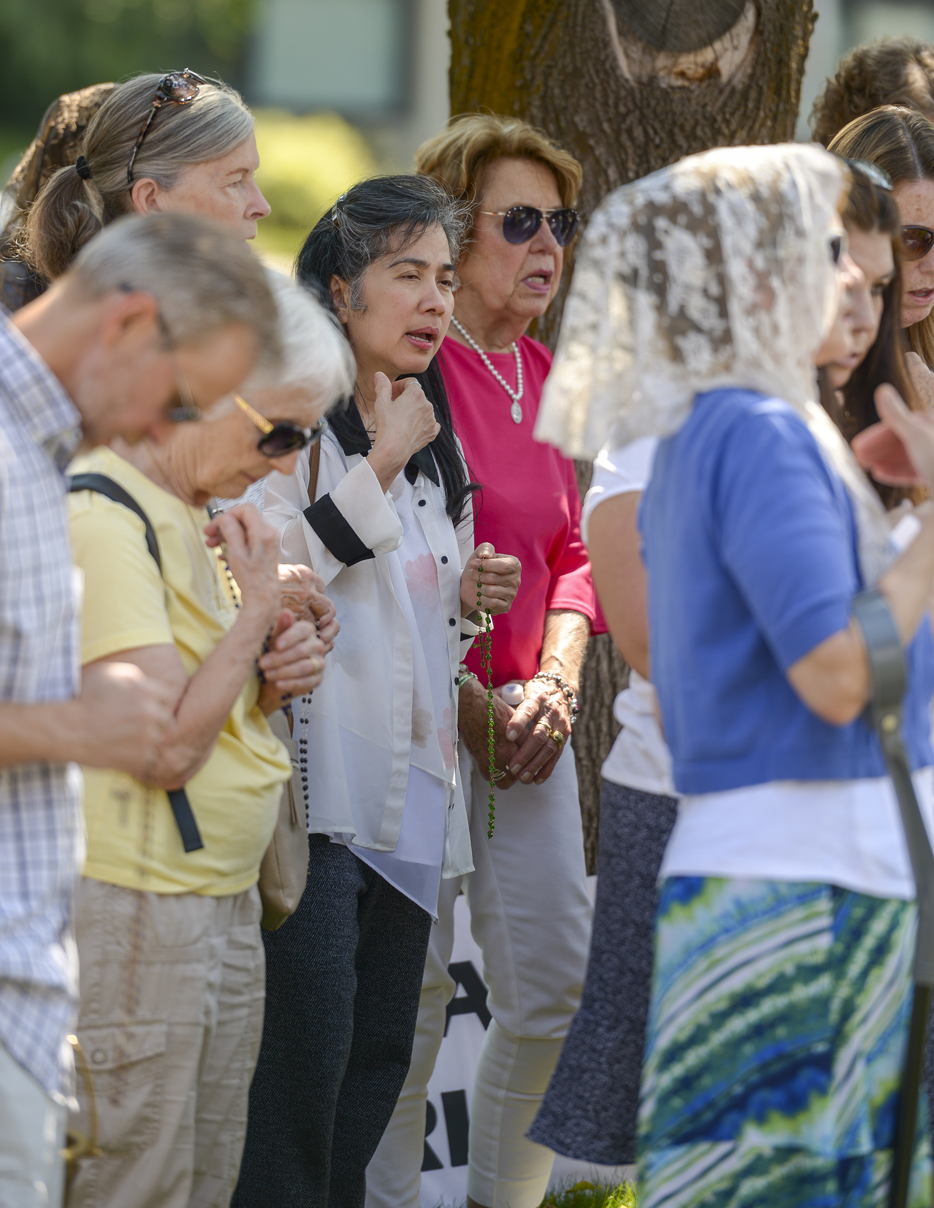 Leah Hogsten | The Salt Lake Tribune Catholic priest, Rev. Jan Bednarz of St. Martin de Porres Parish in Taylorsville, leads the "blessed sacrament" and exorcism at the Planned Parenthood offices on the Feast of the Assumption. Bednarz was joined by the group, "40 Days for Life Utah," to protest Planned Parenthood.