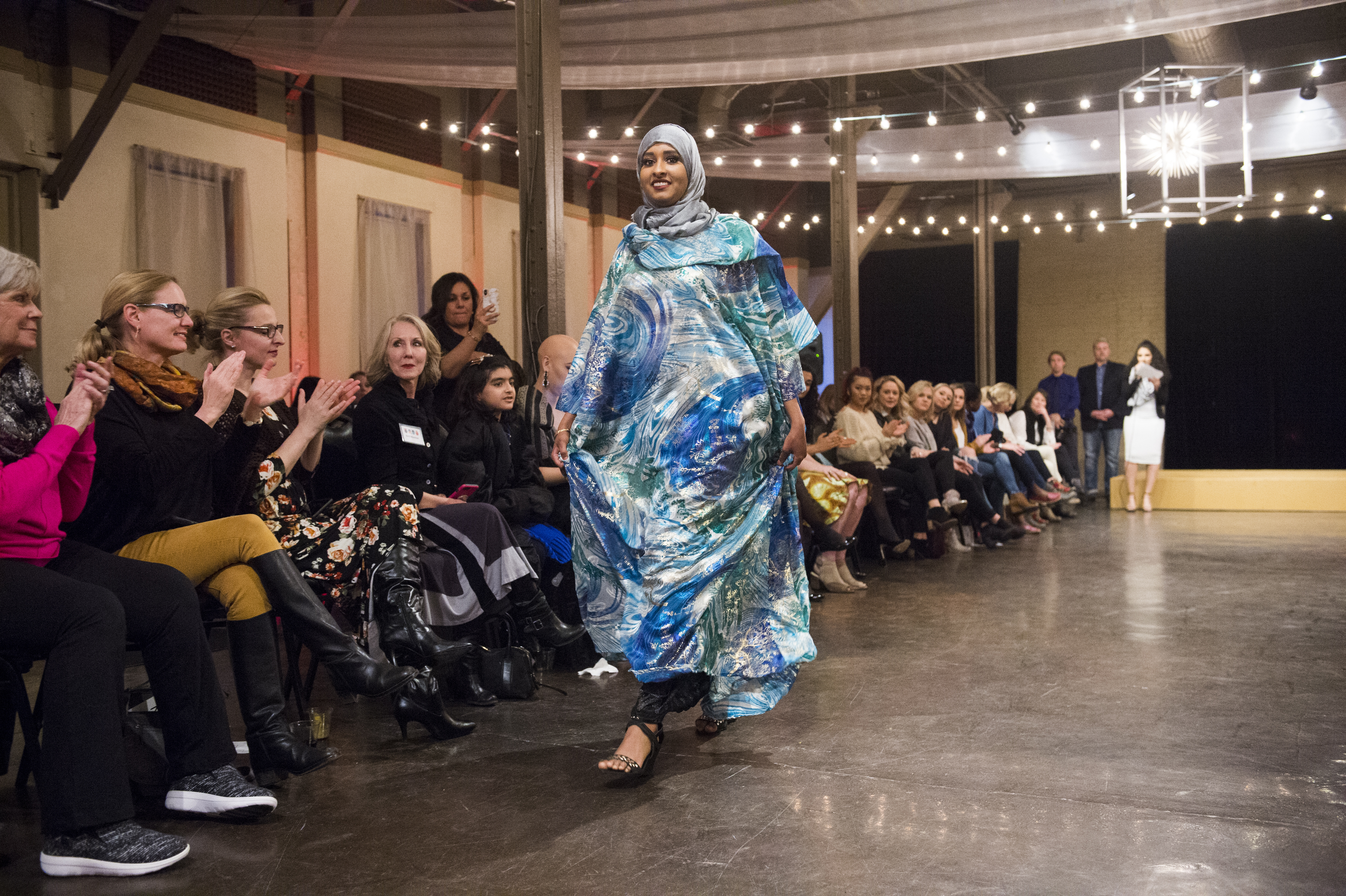 (Rick Egan | The Salt Lake Tribune) Halima Noor, models an outfit from Somalia at the 8th Annual Women of the World Fashion Show. The fashion show fund is raiser for the non-profit that seeks to help refugees settle in a new culture. Wednesday, March 7, 2018. 