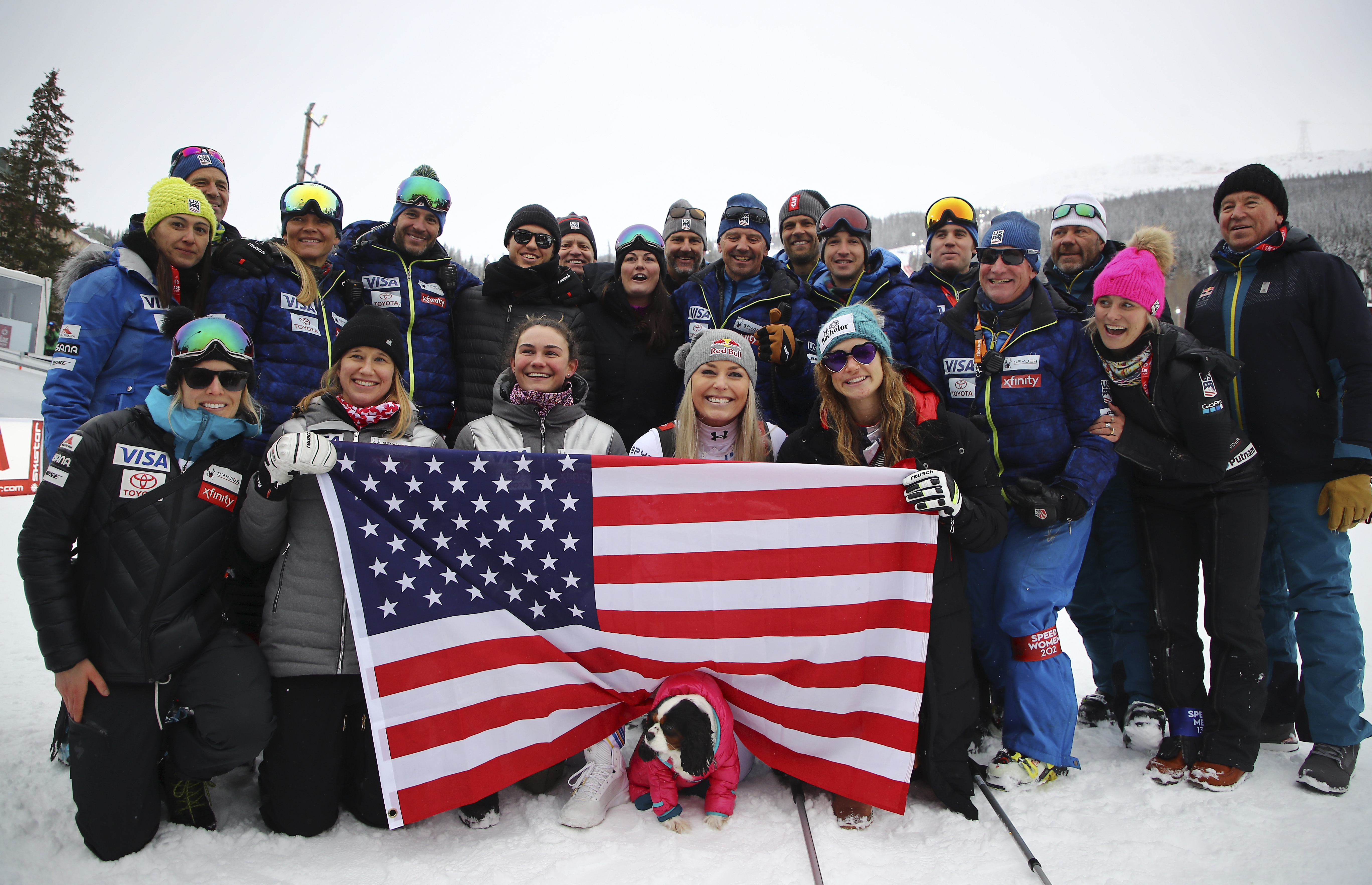 Third placed United States' Lindsey Vonn celebrates with her team in the finish area after the women's downhill race, at the alpine ski World Championships in Are, Sweden, Sunday, Feb. 10, 2019. (AP Photo/Marco Trovati)