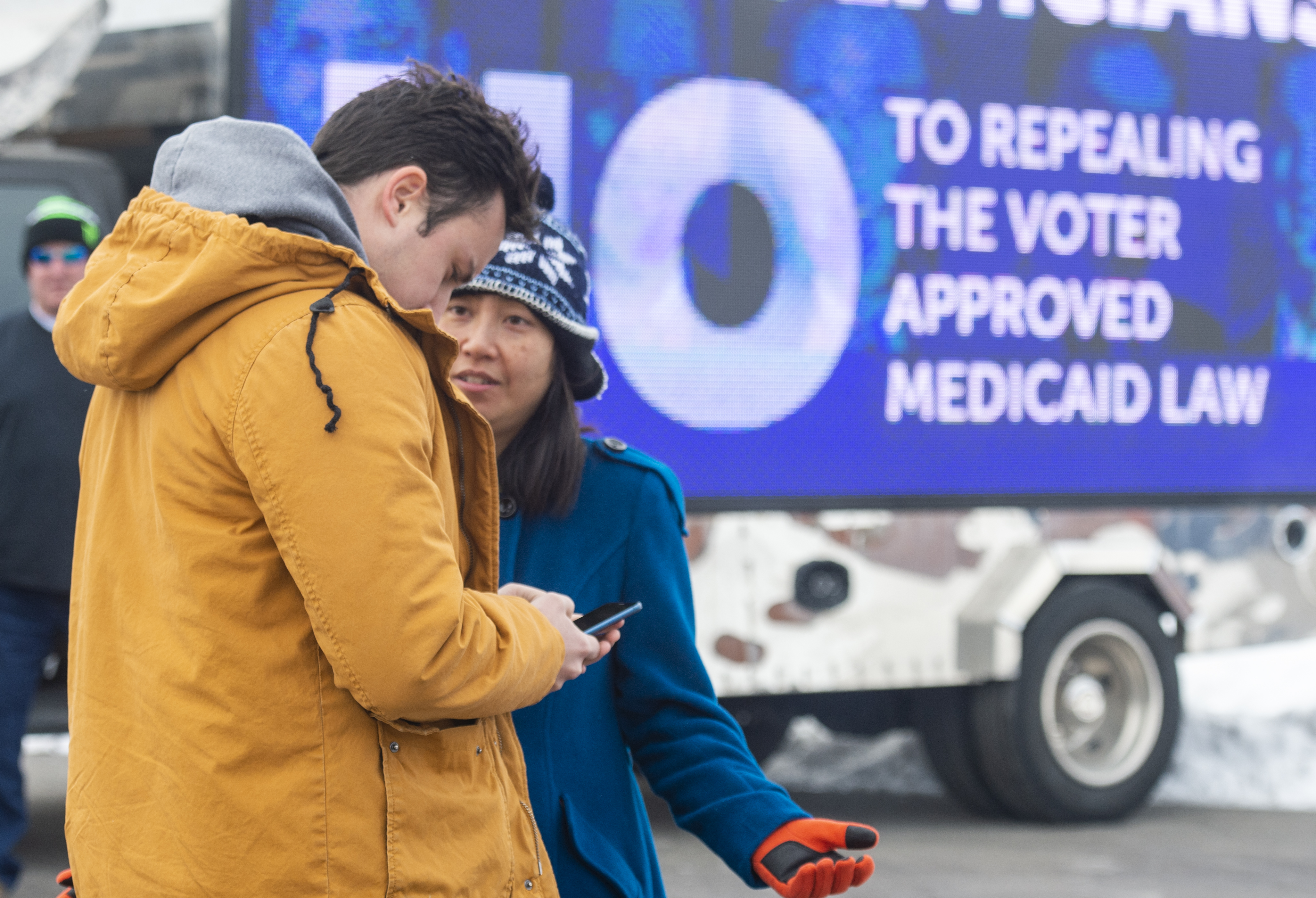 (Rick Egan | The Salt Lake Tribune) Keaton Hill talks to Dawn Le as they plan to canvas a neighborhood in Taylorsville with other supporters of the fuller Medicaid expansion, urging residents to call their senator, Saturday, Feb. 9, 2019. 