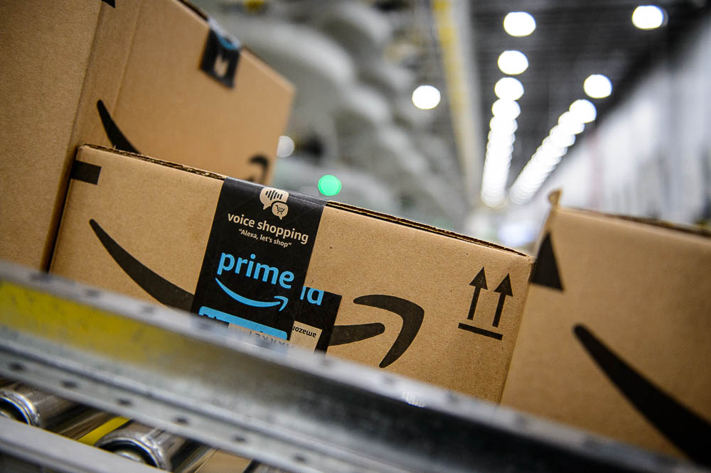 (Trent Nelson | The Salt Lake Tribune) Packages roll down a conveyor belt at Amazon's fulfillment center in Salt Lake City on Wednesday April 17, 2019.
