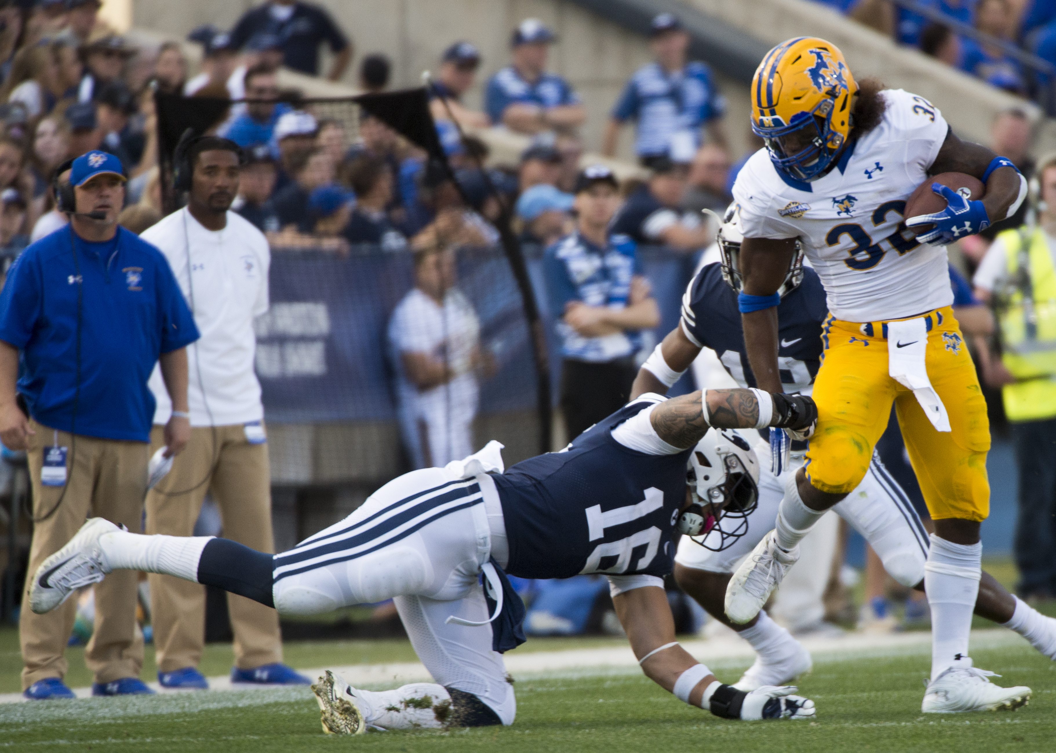 (Rick Egan | The Salt Lake Tribune) Brigham Young Cougars linebacker Sione Takitaki (16) gets his hands on McNeese State Cowboys running back David Hamm (32), in football action Brigham Young Cougars vs McNeese State Cowboys at Lavell Edwards Stadium, Saturday, Sept. 22, 2018. 