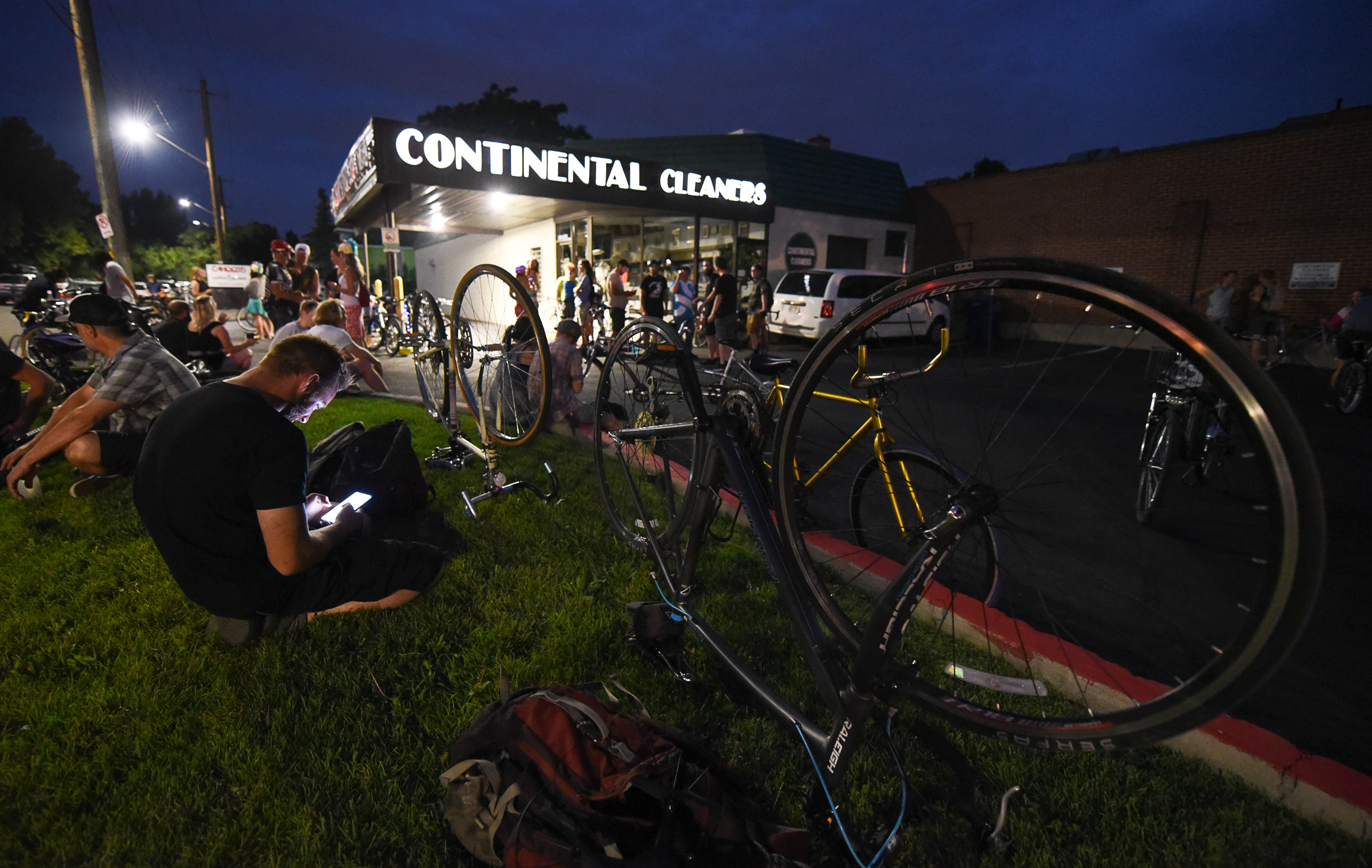 (Francisco Kjolseth | The Salt Lake Tribune) A large group of cyclist gathers on the corner of 9th and 9th at 9pm in Salt Lake City on Thursday, July 26, 2018, for the weekly ride that has become known as the 999 Ride. The inclusive, all-welcoming slow casual social ride happens year round on Thursday nights, with riders often pedaling into the early morning hours. Newly released video shows rider Cameron Hooyer being struck and killed by a FrontRunner train at a downtown railroad crossing during last weeks ride when the 22-year-old failed to stop or heed the warning signals before crossing the tracks during the group ride. 