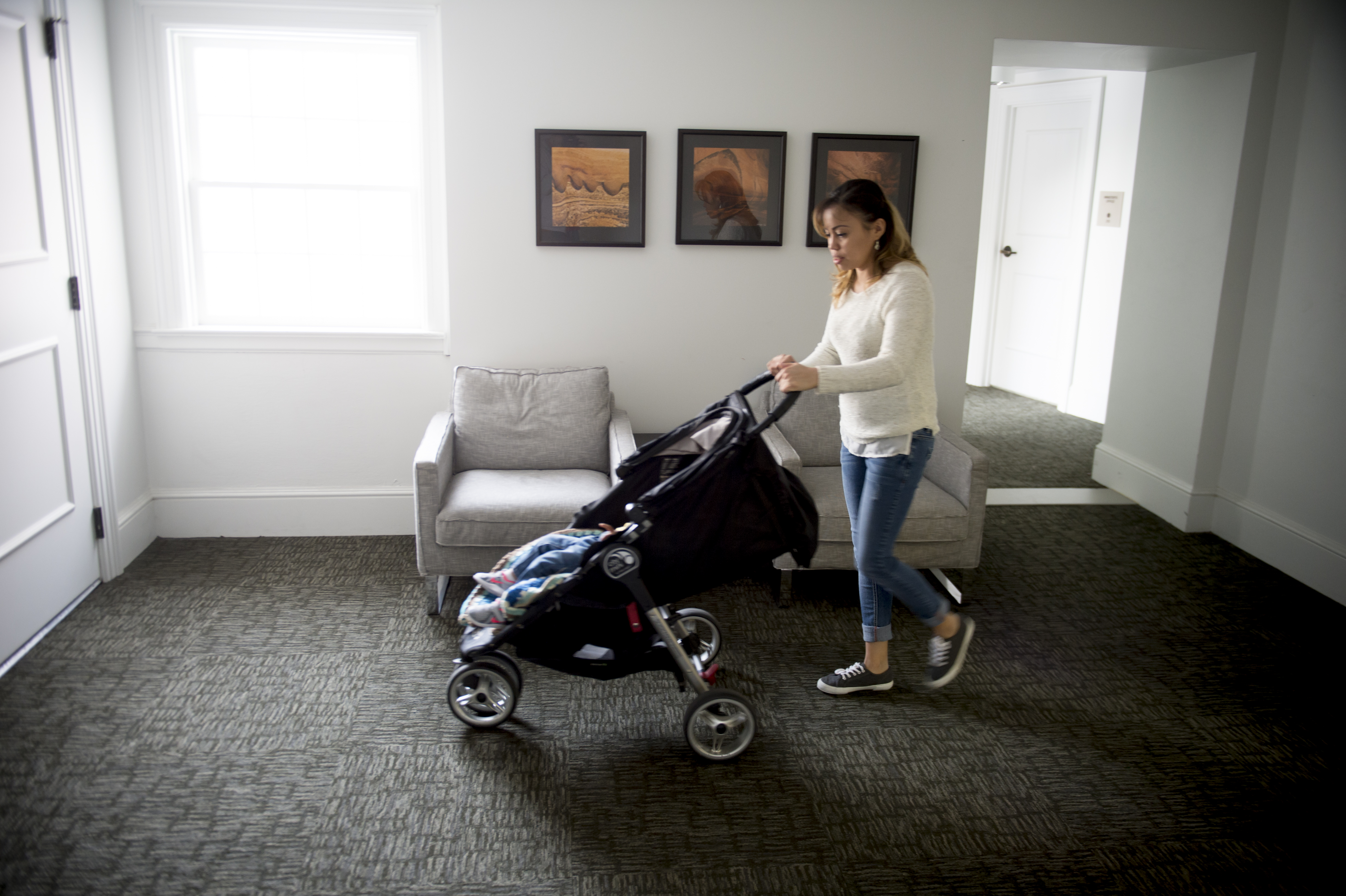 (Jeremy Harmon | The Salt Lake Tribune) Vicky Chavez walks her 17-month-old daughter around the halls of the First Unitarian Church on 1300 East in Salt Lake City on Dec. 14, 2018, as she tries to get her daughter to fall asleep.
