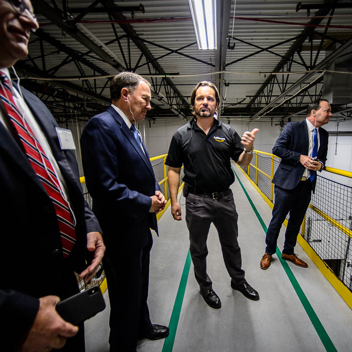 (Trent Nelson | The Salt Lake Tribune) General Manager Mike Taylor with Utah Governor Gary Herbert and Senator Mike Lee on a tour of Amazon's fulfillment center in Salt Lake City on Wednesday April 17, 2019.