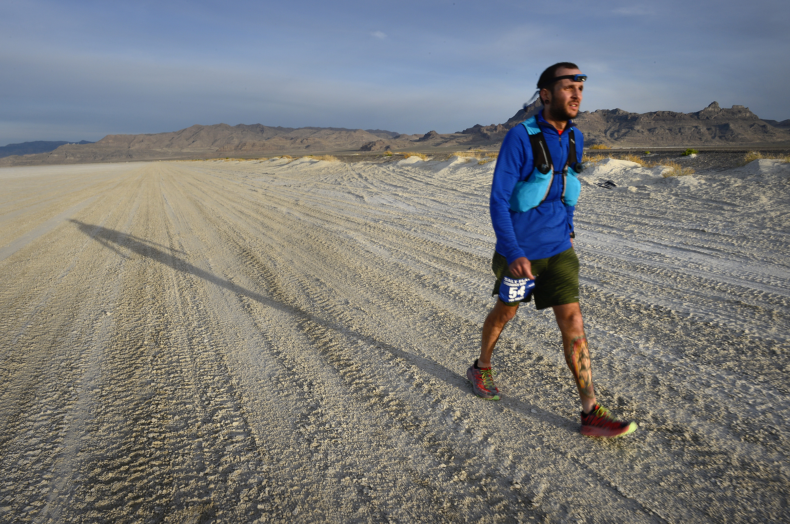 (Scott Sommerdorf | The Salt Lake Tribune) Alex Doolan walks the last mile of the Salt Flats 100 Endurance Run, Saturday, May 5, 2018. 