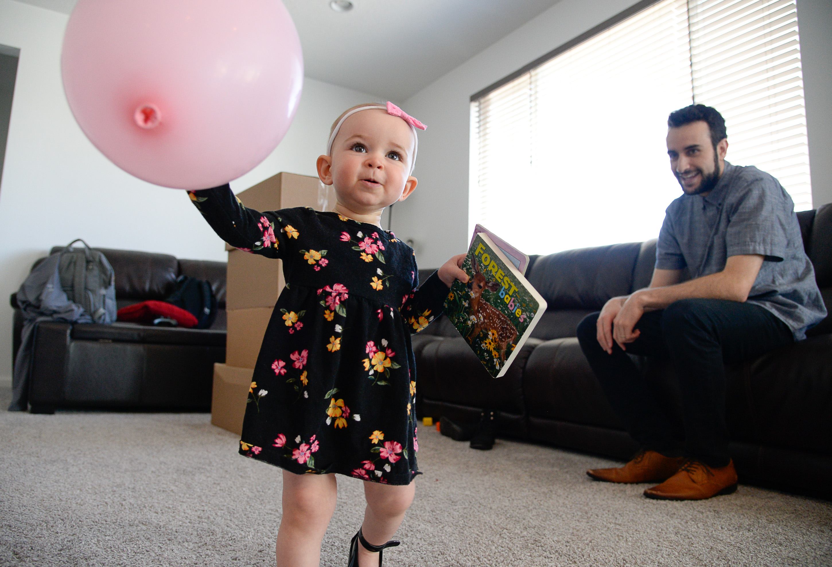 (Francisco Kjolseth | The Salt Lake Tribune) Jeremy spends time with his daughter Jemma, 1, at their home in Lehi after moving there from Pleasant Grove last October with his wife Ember because they could get more house for their money there, and it's closer to Jeremy's job at Adobe in Lehi.