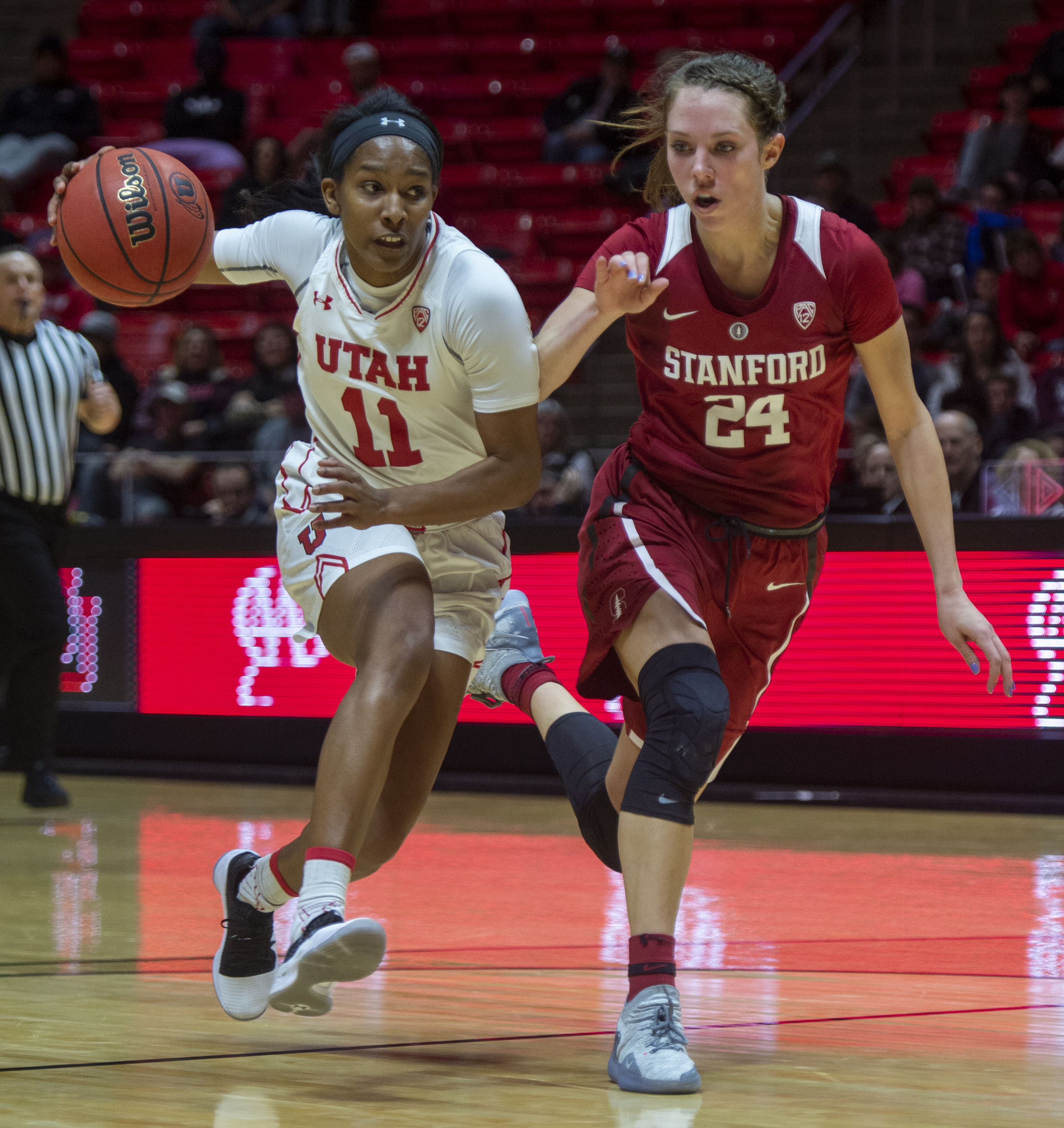 (Rick Egan | The Salt Lake Tribune) Stanford Cardinal forward Lacie Hull (24) tries to keep up with Utah Utes guard Erika Bean (11), in PAC-12 action between the Utah Utes and the Stanford Cardinals at the Jon M. Huntsman Center. Sunday, Jan. 27, 2019. 