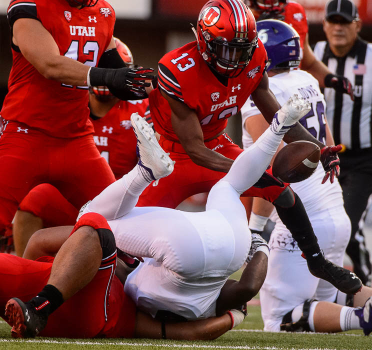 (Trent Nelson | The Salt Lake Tribune) Utah Utes defensive back Marquise Blair (13) grabs a ball stripped from Weber State Wildcats running back Treshawn Garrett (6) as the University of Utah Utes host the Weber State Wildcats, Thursday Aug. 30, 2018 at Rice-Eccles Stadium in Salt Lake City. The ball was ruled dead before the turnover.