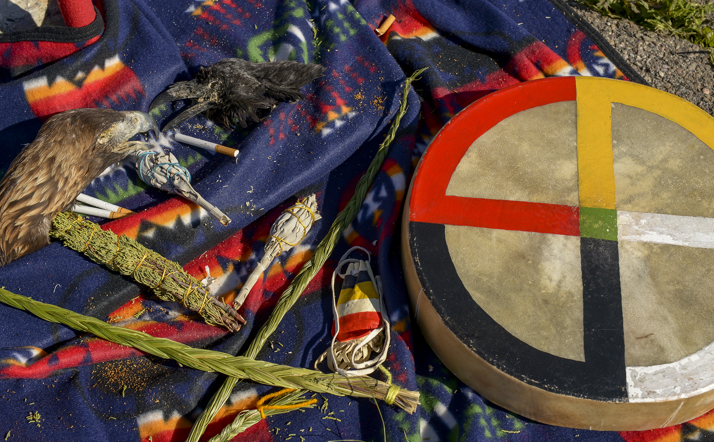 Leah Hogsten | The Salt Lake Tribune Offerings of sweet grass, cedar and tobacco were given during the ceremony from Carl Moore, a Hopi and Chemehuevi Native American The "Stop the Polluting Port" community coalition staged a May Day celebration, calling for respect and awareness of the water, earth and air regarding the 20,000 acres west of Salt Lake City where the inland port industrial site has been proposed.