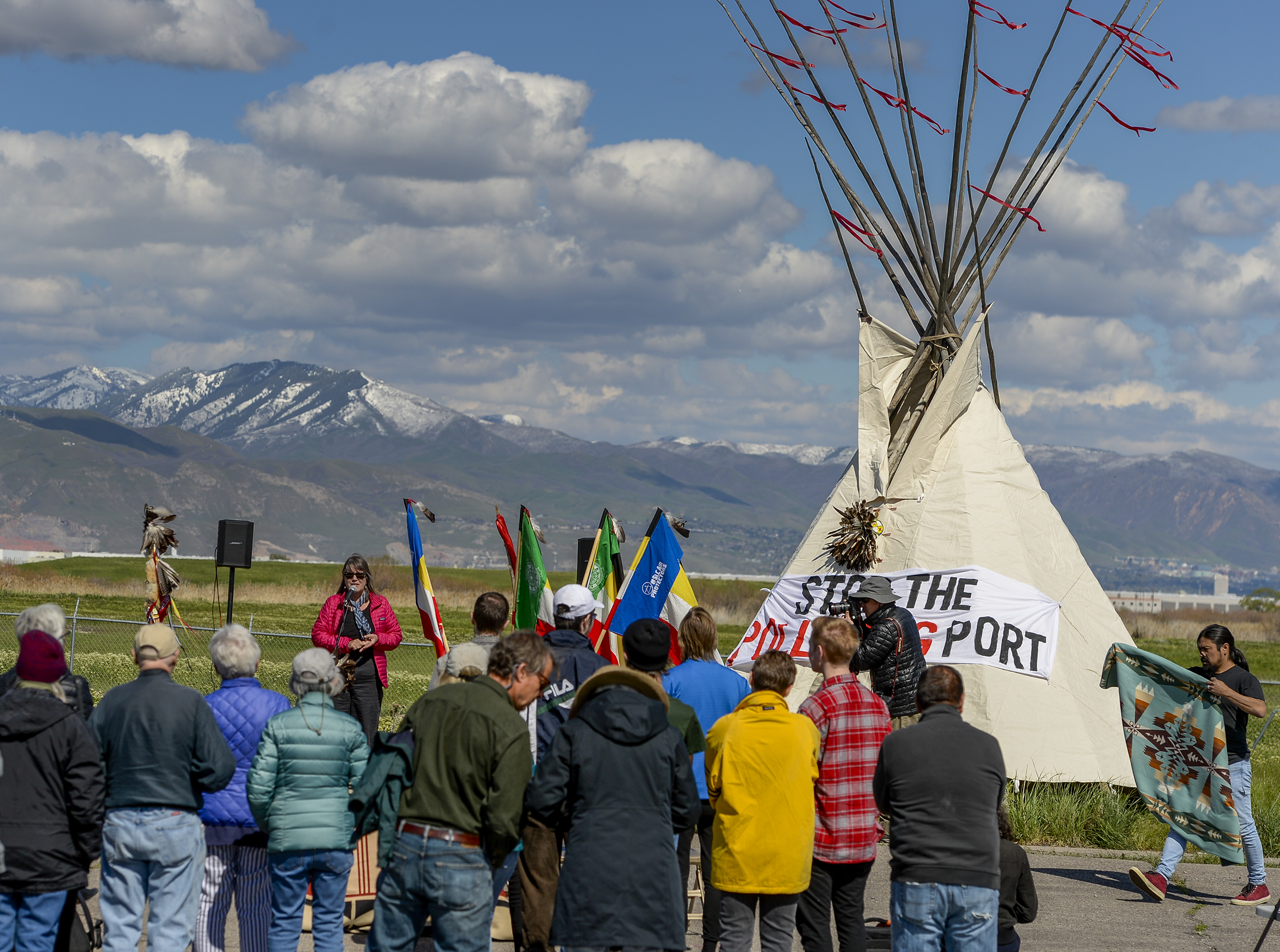 Leah Hogsten | The Salt Lake Tribune Deeda Seed, a senior campaigner with the Center for Biological Diversity welcomes the crowd, near the dump site on 7200 West and I-80.. The "Stop the Polluting Port" community coalition staged a May Day celebration, calling for respect and awareness of the water, earth and air regarding the 20,000 acres west of Salt Lake City where the inland port industrial site has been proposed.