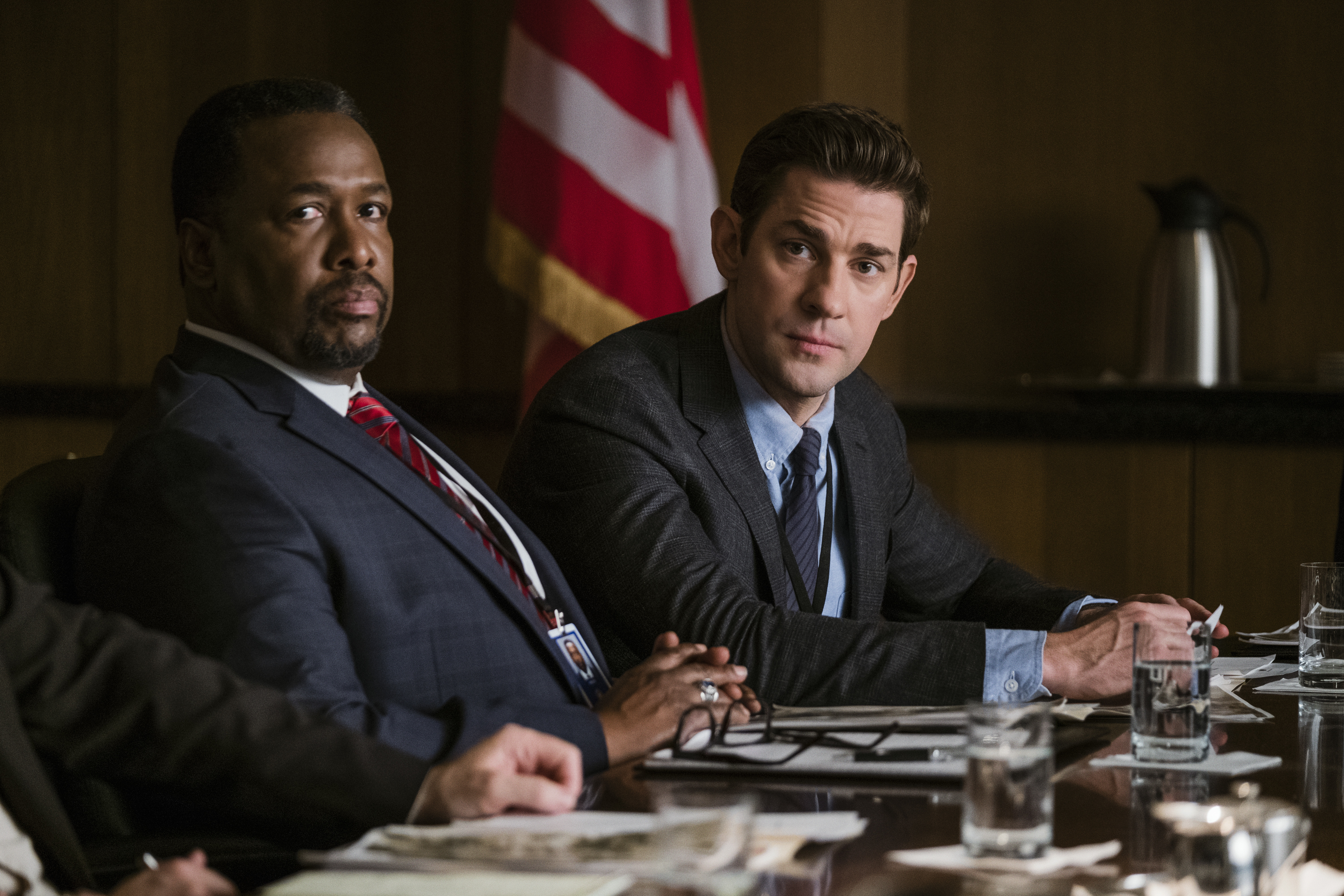 This image released by Amazon shows Wendell Pierce, left, and John Krasinski in a scene from "Tom Clancy's Jack Ryan." (Philippe Bossé/Amazon via AP)