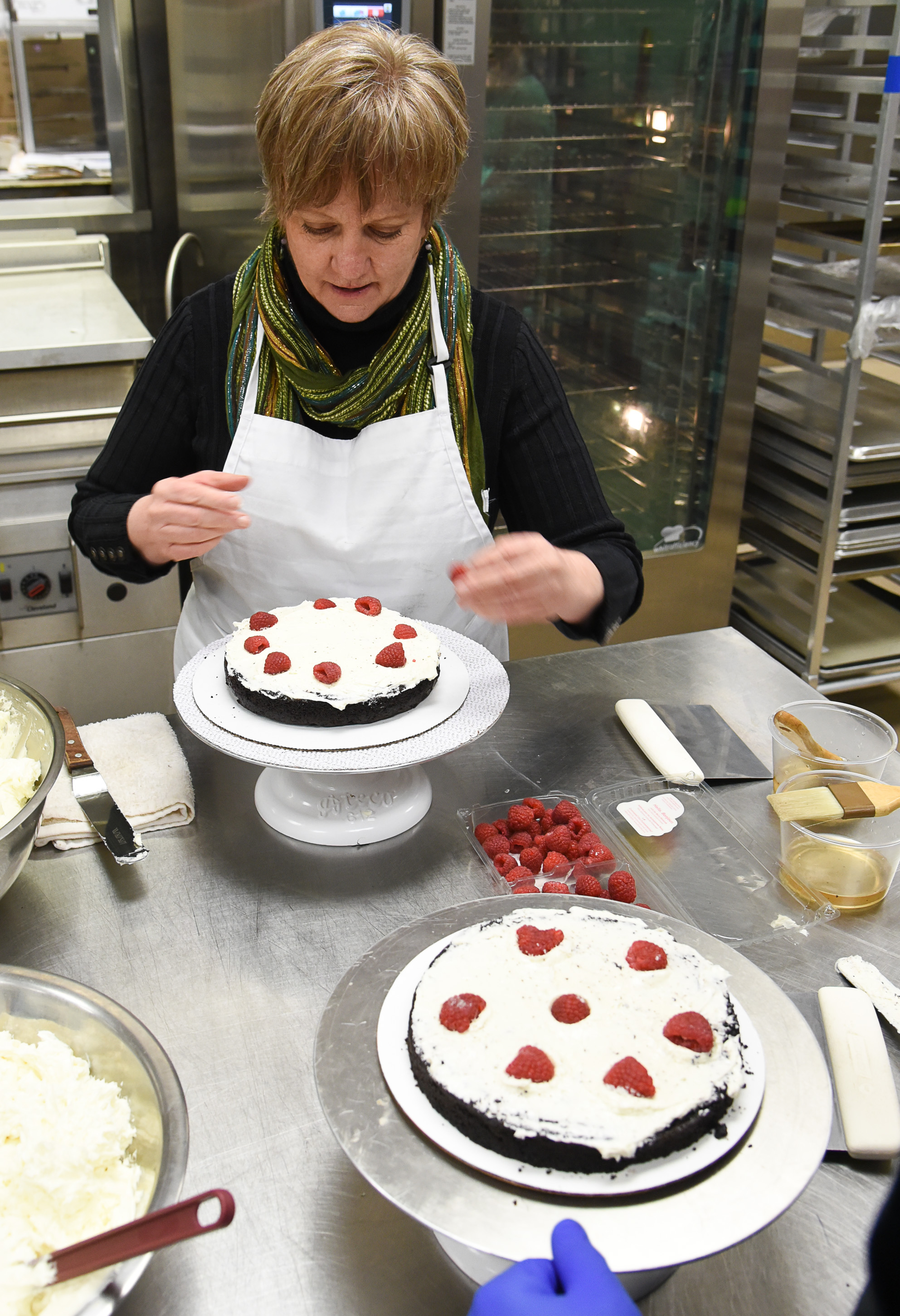 (Francisco Kjolseth | The Salt Lake Tribune) Actress Betsy West prepares for the upcoming role of a Southern Baptist bakery owner in North Carolina faced with a request to bake a cake for a gay couple getting married for Salt Lake Acting Company's production of "The Cake." A self admitted baking novice, West, in search of better authenticity in portraying her role received a one-on-one lesson from the chef's at Flourish Bakery.