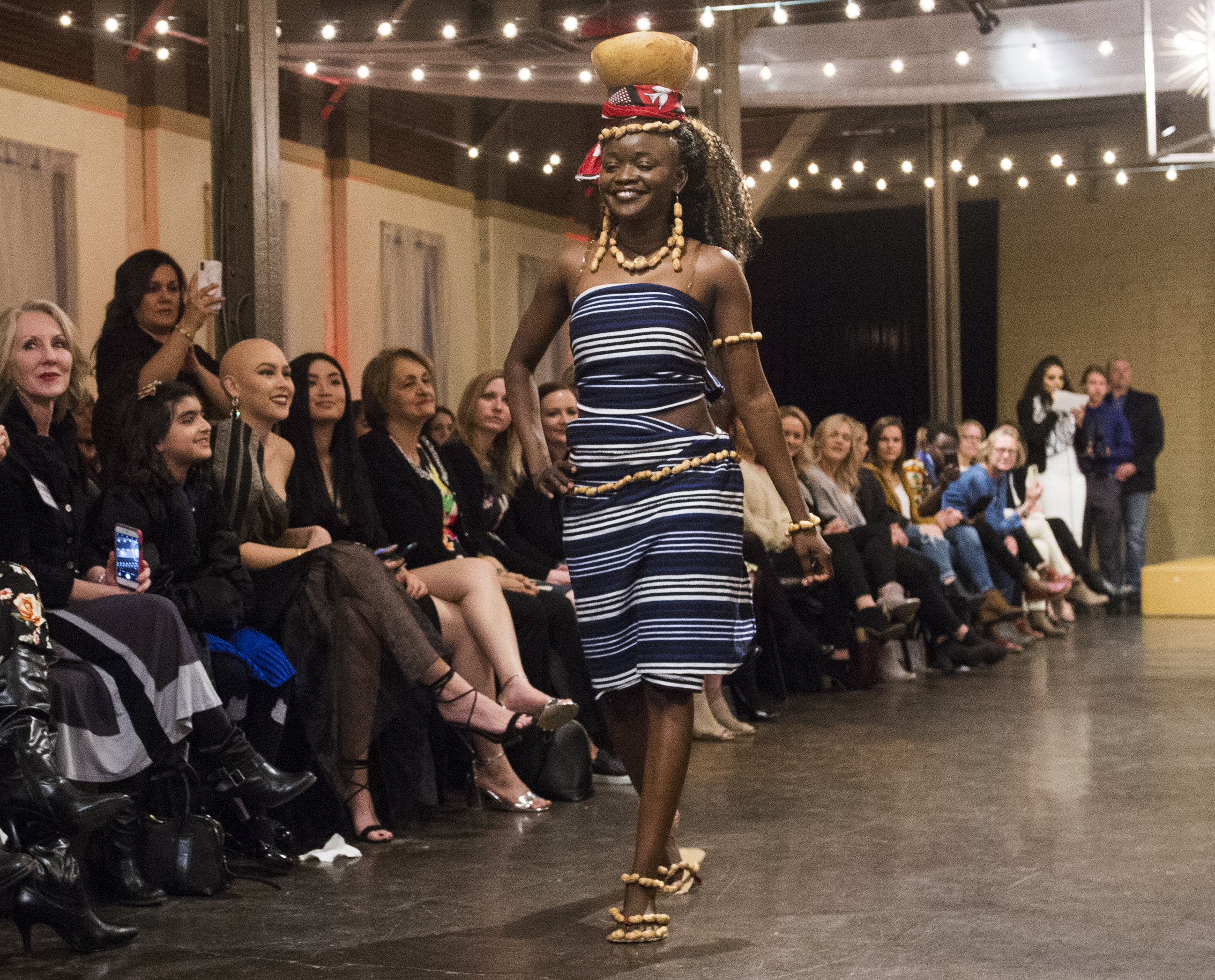 (Rick Egan | The Salt Lake Tribune) Diane Sawadogo from Burkina Faso, walks the runway, at the 8th Annual Women of the World Fashion Show. The fashion show fund is raiser for the non-profit that seeks to help refugees settle in a new culture. Wednesday, March 7, 2018. 