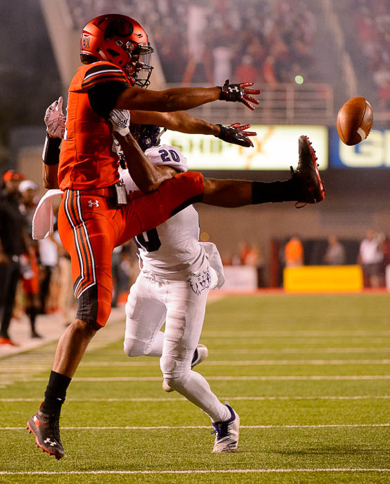 (Trent Nelson | The Salt Lake Tribune) Utah Utes wide receiver Solomon Enis (21) defended by Weber State Wildcats cornerback Parker Preator (20) as the University of Utah Utes host the Weber State Wildcats, Thursday Aug. 30, 2018 at Rice-Eccles Stadium in Salt Lake City.