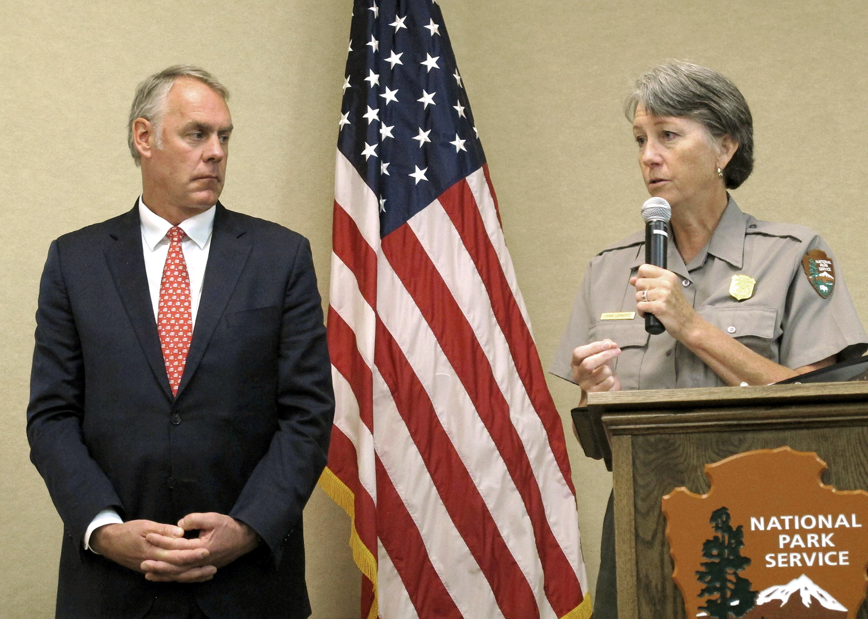 FILE - In this Oct. 13, 2017, file photo, then-Interior Secretary Ryan Zinke, left, and Grand Canyon National Park Superintendent Christine Lehnertz address National Park Service employees at Grand Canyon National Park, Ariz. Lehnertz is returning to work after being cleared in a federal investigation. (AP Photo/Felicia Fonseca, File)