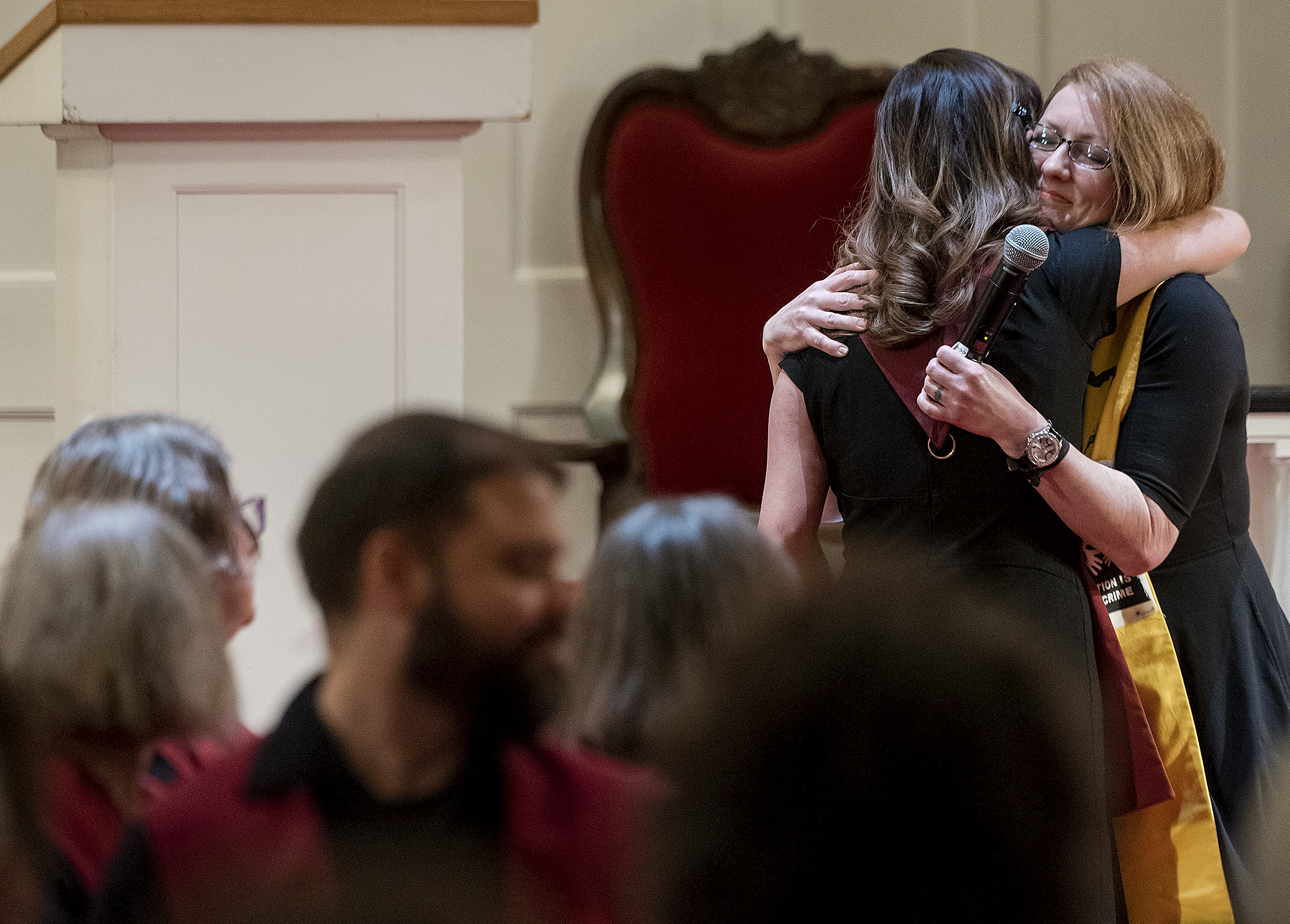 Michael Mangum | Special to the Tribune Vicky Chavez, left, hugs Rev. Monica Dobbins during a vigil held at First Unitarian Church in Salt Lake City, UT on Wednesday, January 30th, 2019. The vigil marked the one-year anniversary of when Chavez came to the church with her children seeking sanctuary from deportation.
