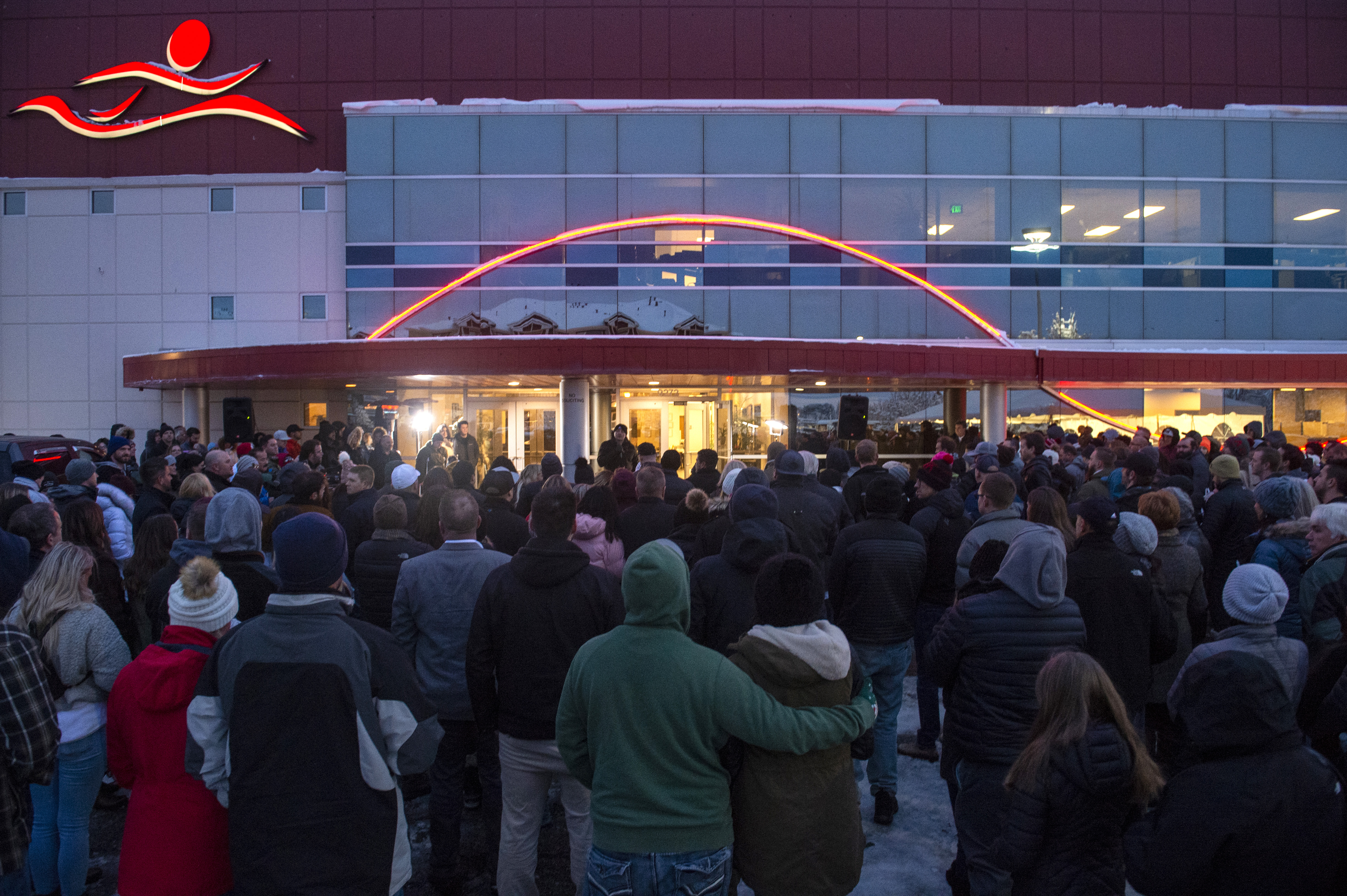 (Rick Egan | The Salt Lake Tribune) Friends and loved ones of David Stokoe gather for a candlelight vigil at the RanLife Home Loans building where he worked in Sandy, Monday, Jan. 21, 2019.
