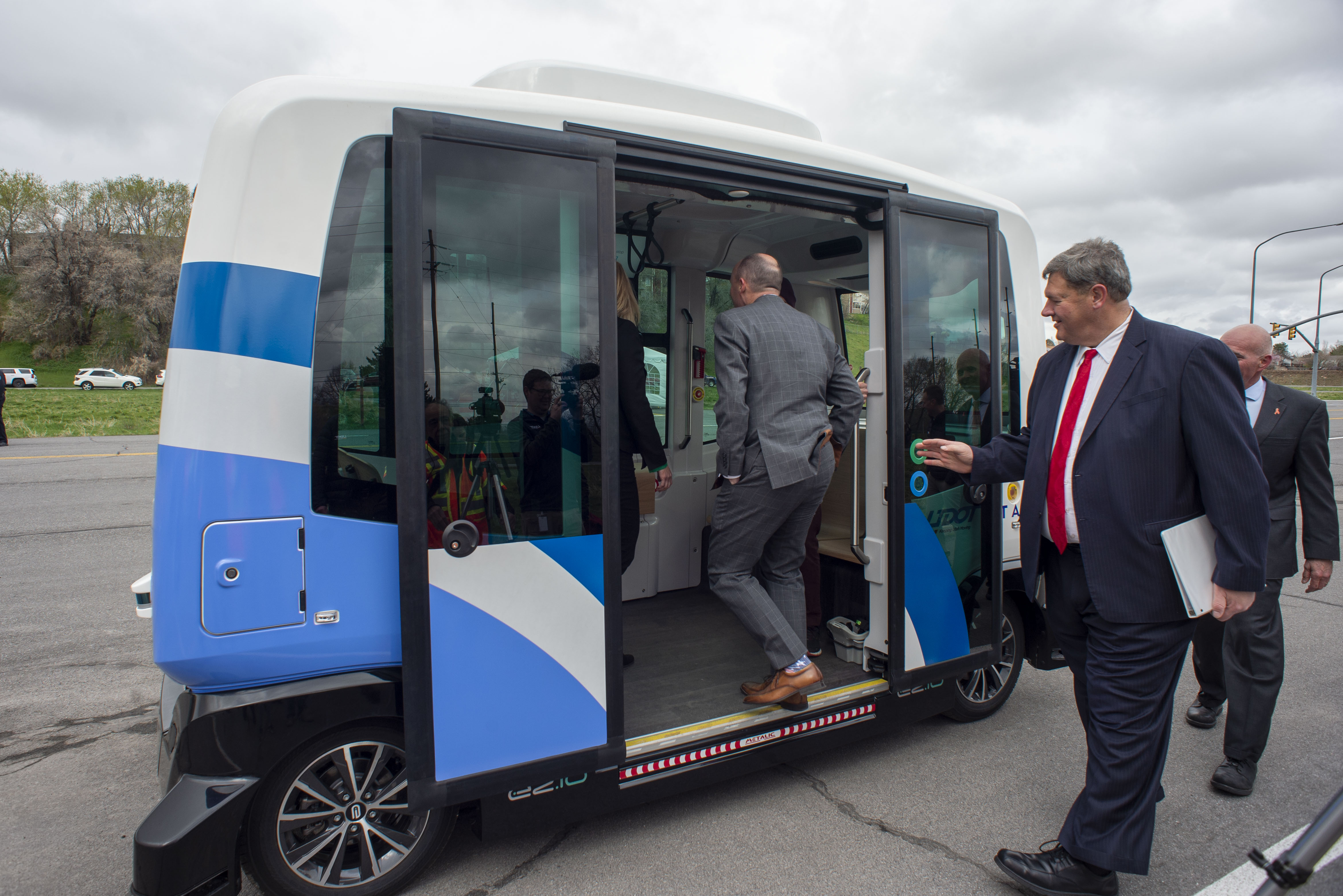 (Rick Egan | The Salt Lake Tribune) Lt. Governor Spencer J. Cox, UDOT Executive Director Carlos Braceras, and UTA Board Chair Carlton Christensen Board the Autonomous Shuttle for a test drive, at the test track is across the street from UDOT headquarters on the west side of 2700 West. Thursday, April 11, 2019. 