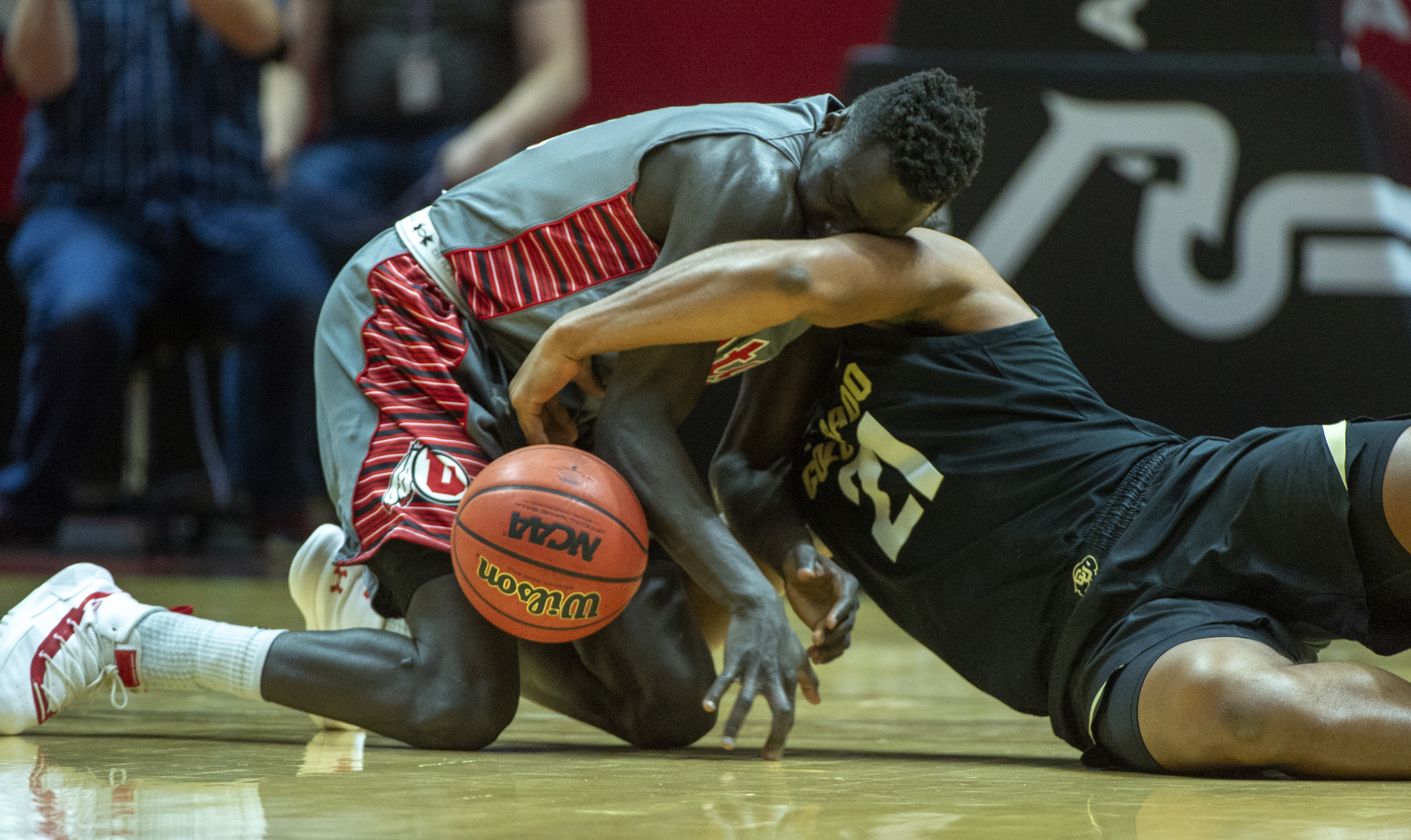 (Rick Egan | The Salt Lake Tribune) Utah Utes forward Both Gach (11) goes for a loose ball along with Colorado Buffaloes forward Evan Battey (21), in PAC-12 basketball action between the Utah Utes and the Colorado Buffaloes at the Jon M. Huntsman Center, Sunday, Jan. 20, 2019. 