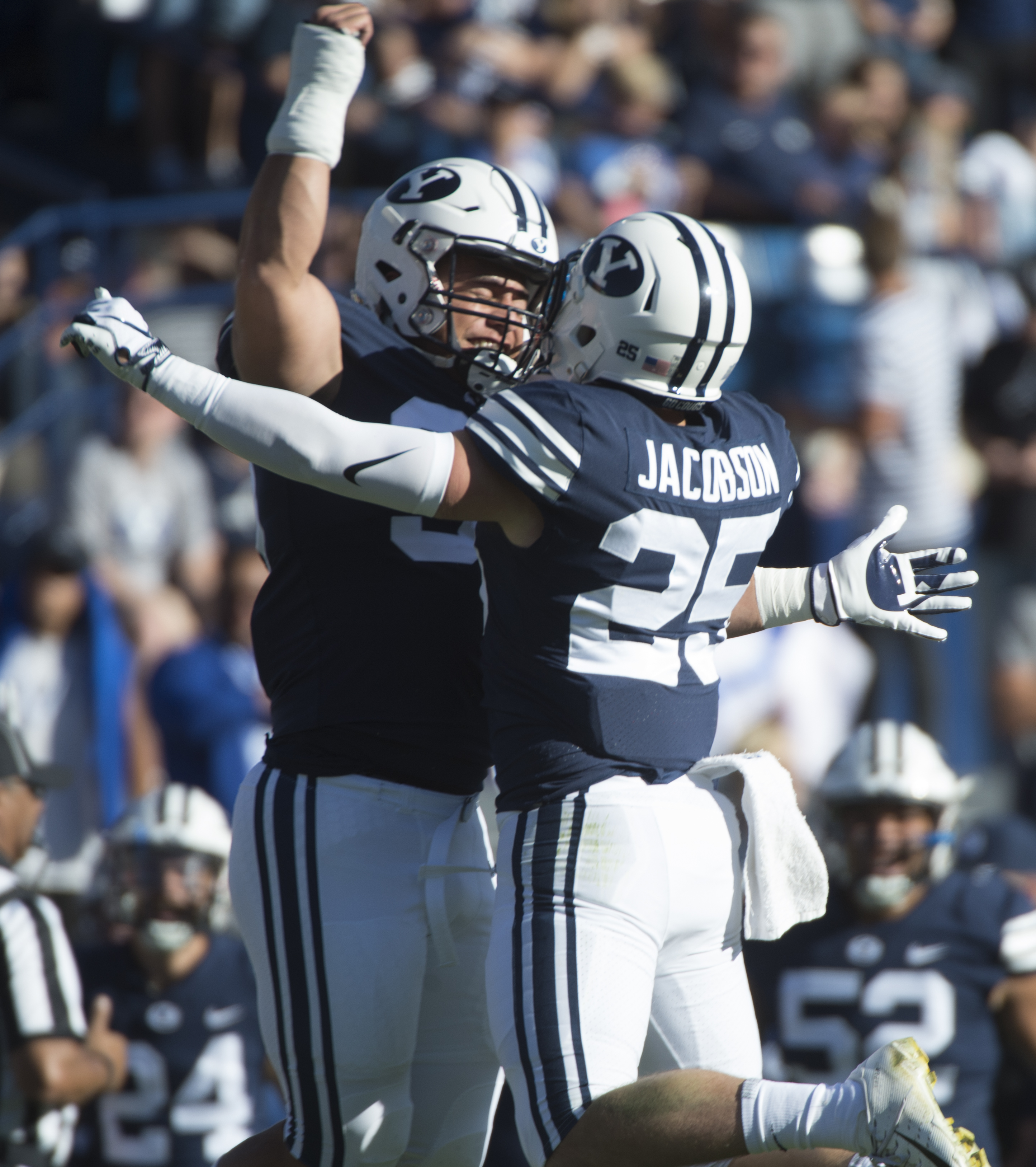 (Rick Egan | The Salt Lake Tribune) Brigham Young defensive lineman Corbin Kaufusi (90) celebrates with linebacker, Tanner Jacobson (25), after Jacobsen intercepted the ball for the Cougars, an interception, in football action between Brigham Young Cougars and McNeese State Cowboys, at Lavell Edwards Stadium, Saturday, Sept. 22, 2018. 