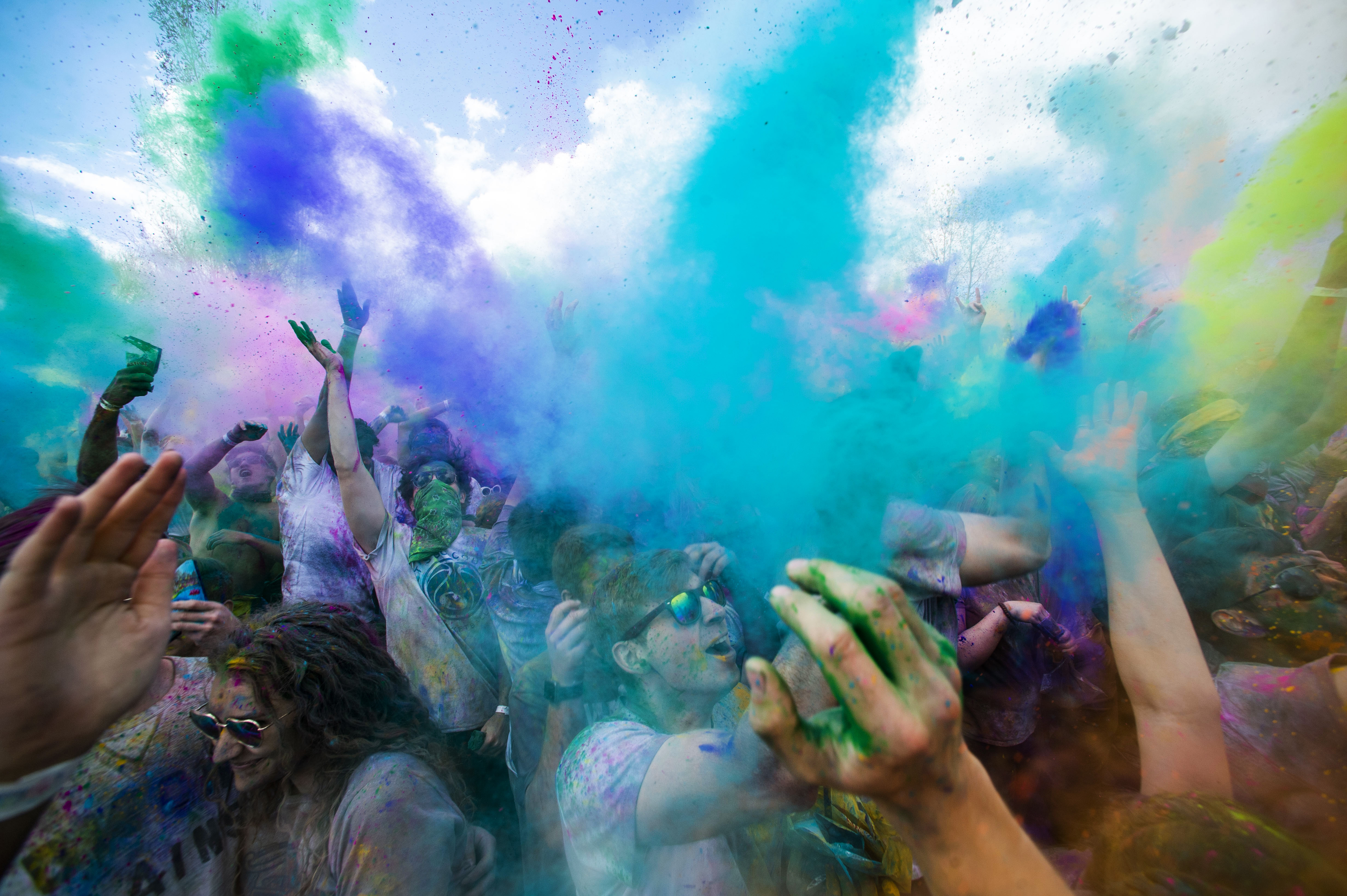 (Rick Egan | The Salt Lake Tribune) Revelers toss colored powder into the air as they celebrate the arrival of spring, during the Holi Festival of Colors celebration at the Sri Sri Radha Krishna Temple in Spanish Fork, Saturday, March 30, 2019. 