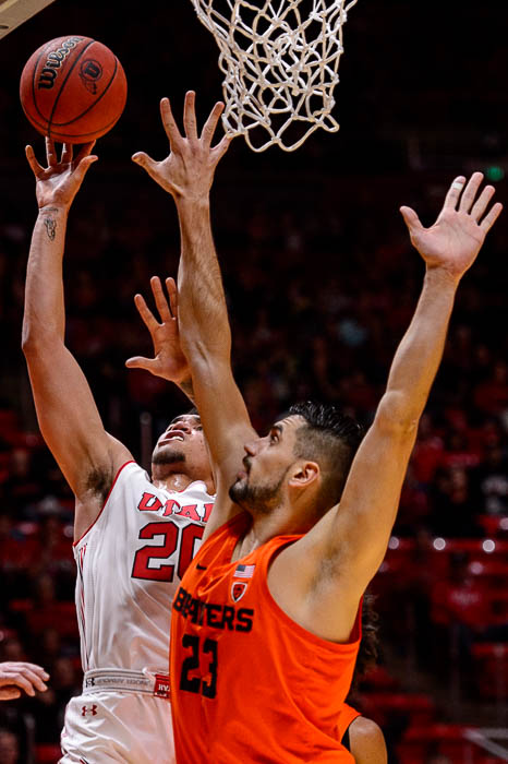 (Trent Nelson | The Salt Lake Tribune) Utah Utes forward Timmy Allen (20) shoots, defended by Oregon State Beavers center Gligorije Rakocevic (23) as Utah hosts Oregon State, NCAA basketball in Salt Lake City on Saturday Feb. 2, 2019.