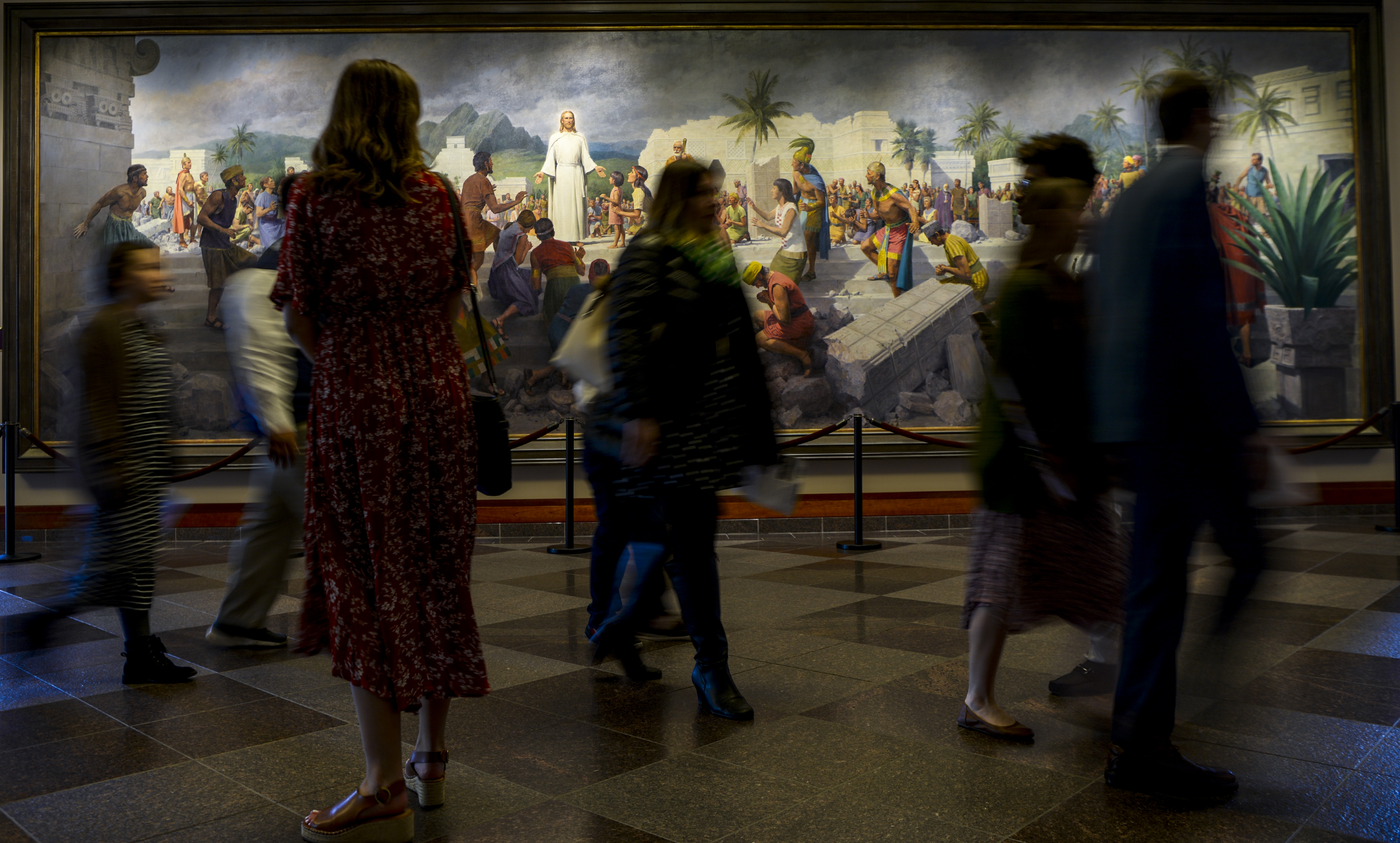 Leah Hogsten | The Salt Lake Tribune Members file into the 189th Annual General Conference of The Church of Jesus Christ of Latter-day Saints in Salt Lake City in front of a painting titled "Jesus Christ Visits the Americas" by John Scott.