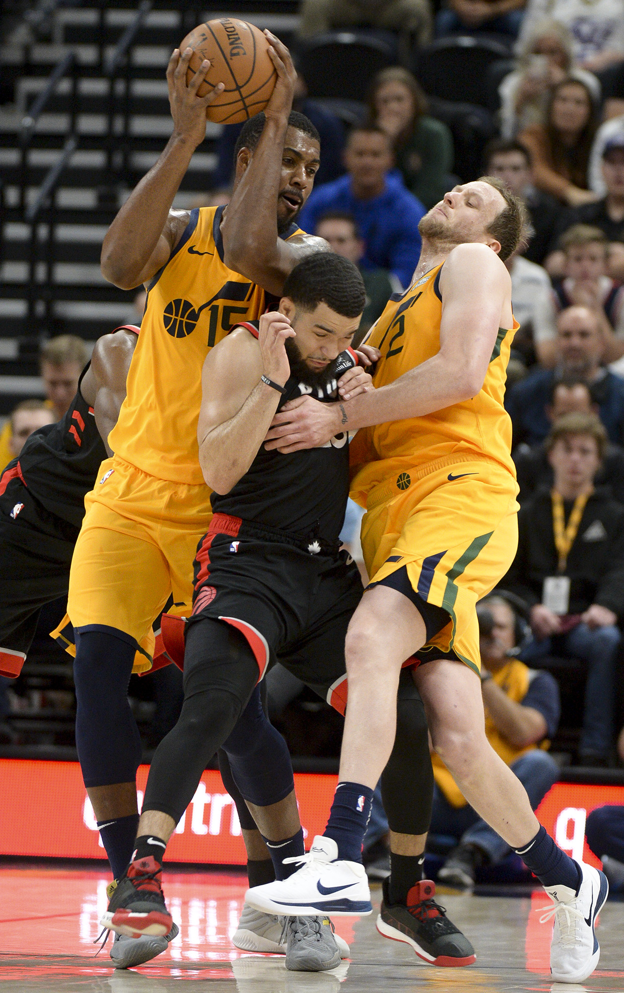 Leah Hogsten | The Salt Lake Tribune Toronto Raptors guard Fred VanVleet (23) is sandwiched between Utah Jazz forward Joe Ingles (2) and Utah Jazz forward Derrick Favors (15) as the Utah Jazz lose to the Toronto Raptors, 111-124, Monday, Nov. 5, 2018 at Vivant Smart Home Arena.