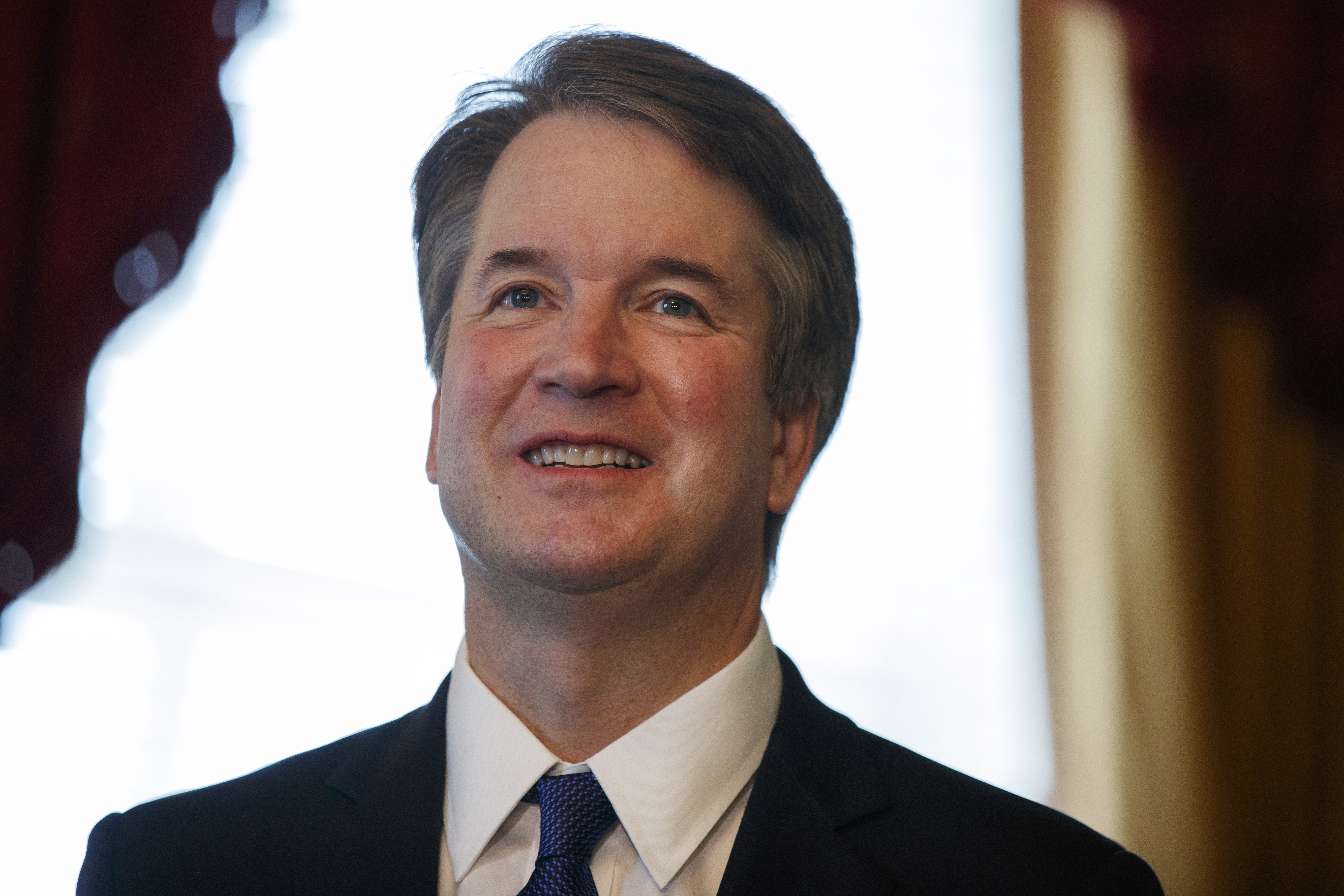 Supreme Court nominee Brett Kavanaugh smiles during a meeting with Sen. Orrin Hatch, R-Utah, on Capitol Hill, Wednesday, July 11, 2018, in Washington. (AP Photo/Evan Vucci)