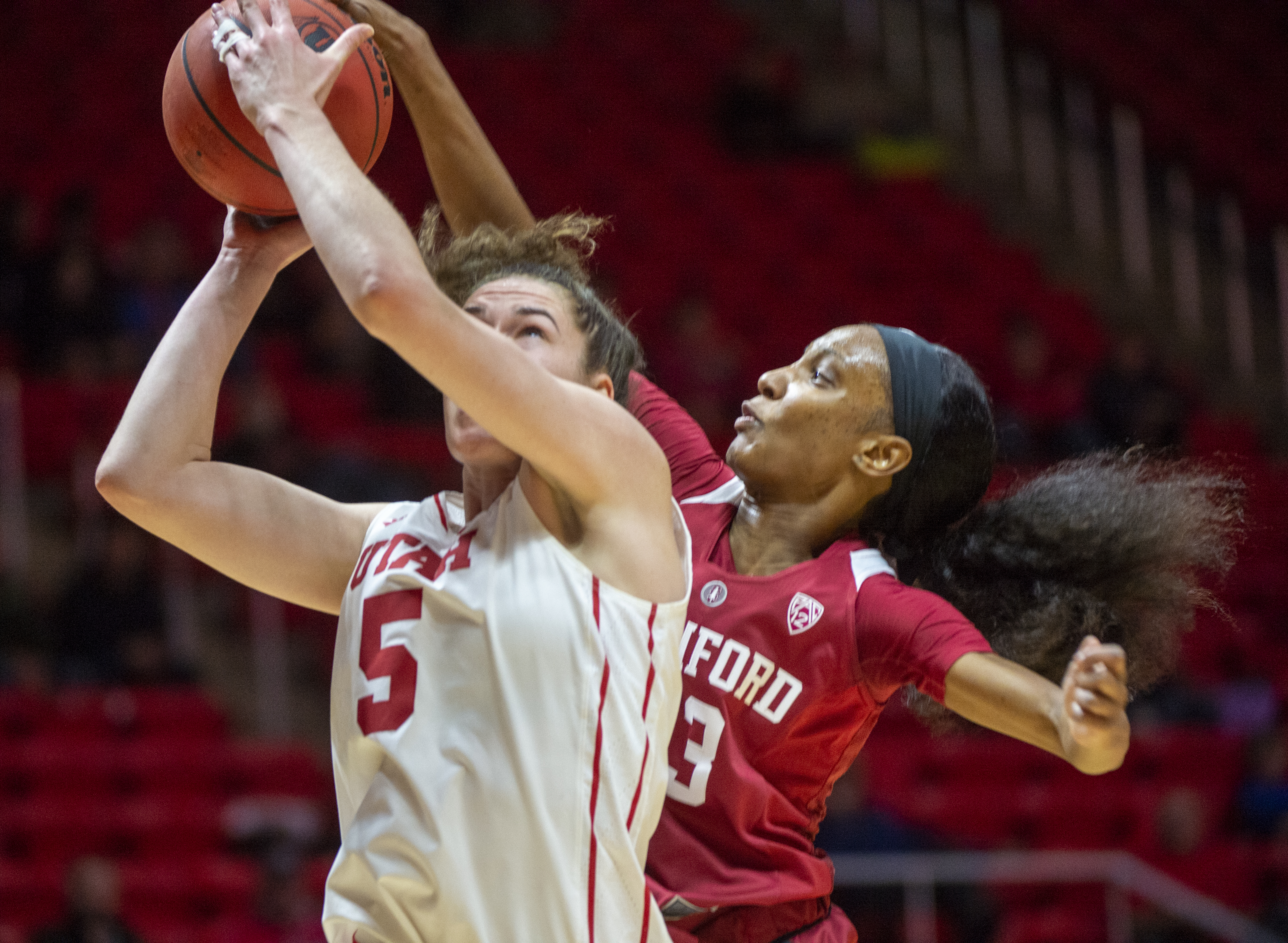 (Rick Egan | The Salt Lake Tribune) Utah Utes forward Megan Huff (5) shoots as Stanford Cardinal guard Marta Sniezek (13) comes from behind for a block, in PAC-12 action between the Utah Utes and the Stanford Cardinals at the Jon M. Huntsman Center. Sunday, Jan. 27, 2019. 