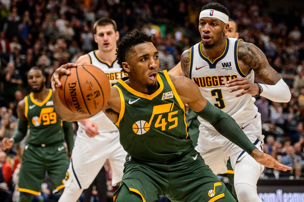 (Trent Nelson | The Salt Lake Tribune) Utah Jazz guard Donovan Mitchell (45) recovers a loose ball as the Utah Jazz host the Denver Nuggets, NBA basketball in Salt Lake City on Wednesday Jan. 23, 2019.