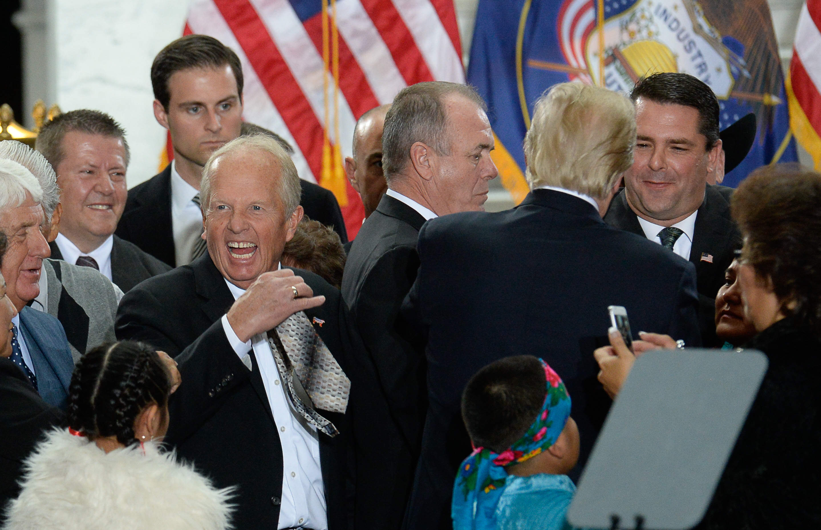 (Francisco Kjolseth | The Salt Lake Tribune) Rep. Mike Noel, R-Kanab, delights in having his tie signed by President Donald Trump at the Utah Capitol on Monday, Dec. 4, 2017, after Trump's signing of two presidential proclamations to shrink Bears Ears and Grand Staircase-Escalante national monuments.