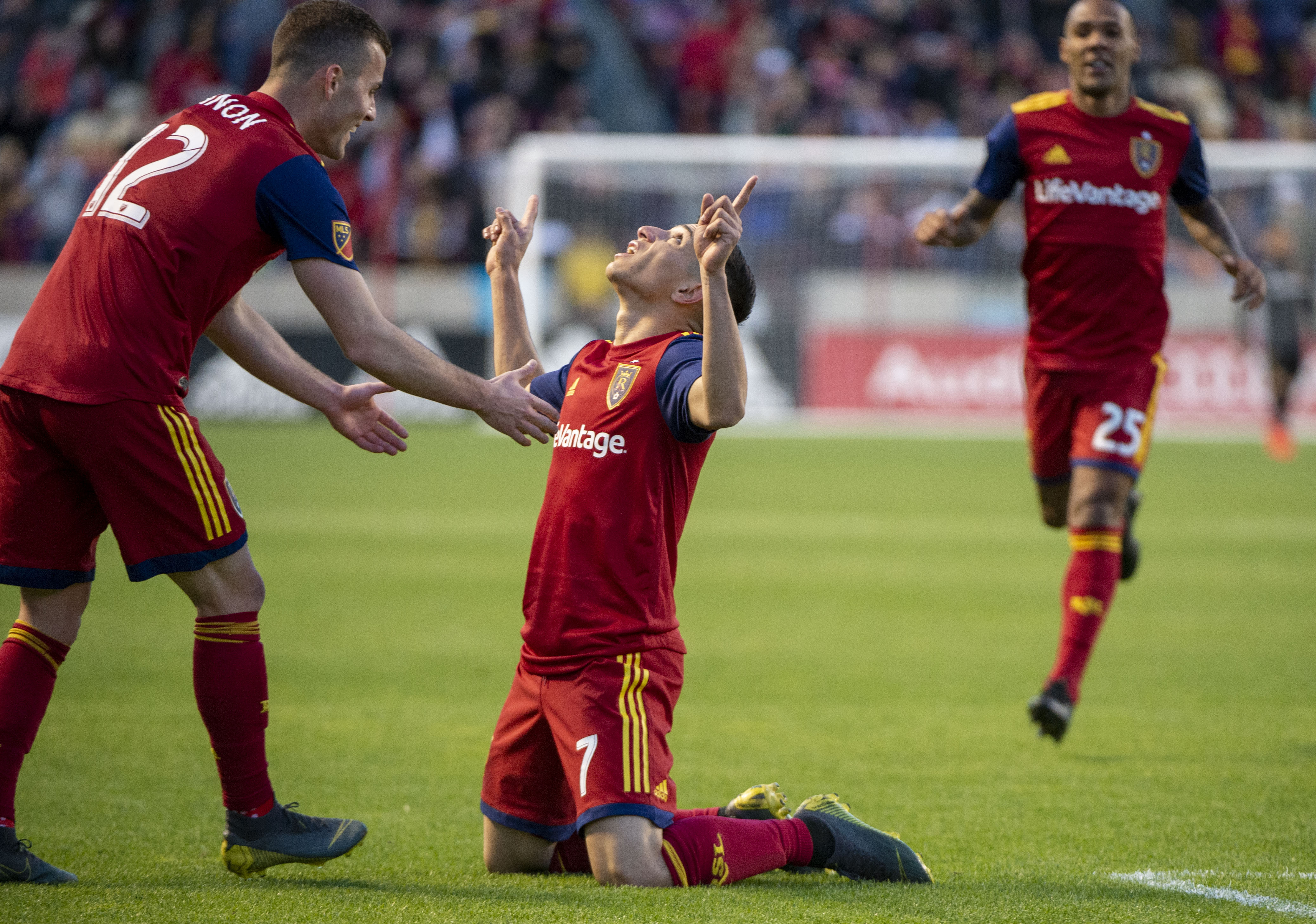 (Rick Egan | The Salt Lake Tribune) Real Salt Lake forward Brooks Lennon (12) reaches down to congratulate Real forward Jefferson Savarino (7) after he scored a goal for Salt Lake, at Rio Tinto Stadium, Saturday, March 30, 2019. 