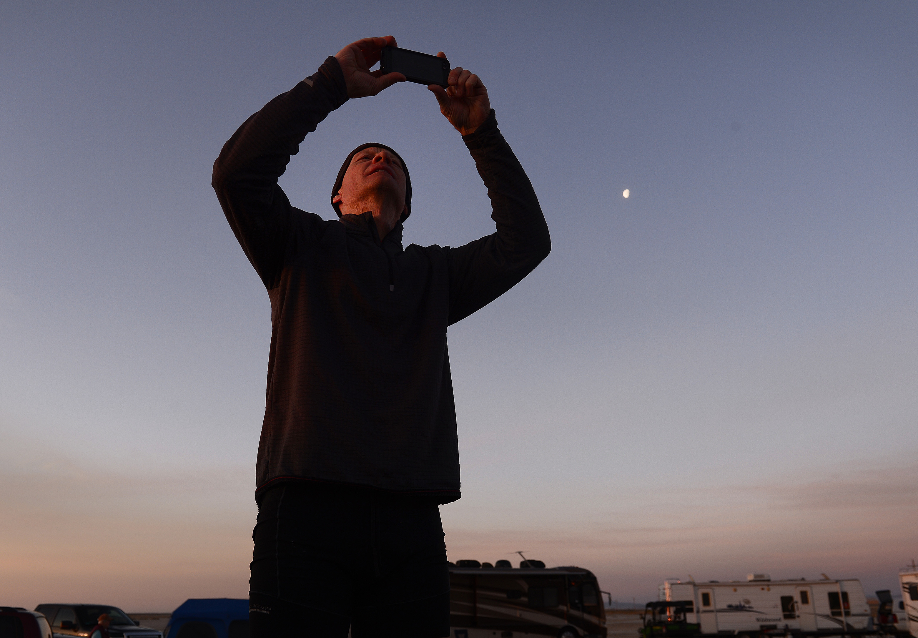 (Scott Sommerdorf | The Salt Lake Tribune) Peter Van Horn makes a photo of the Salt Flats as the sun rises at the Salt Flats 100 Endurance Run, Saturday, May 5, 2018. Van Horn paced his brother Matt Van Horn who won the race. 