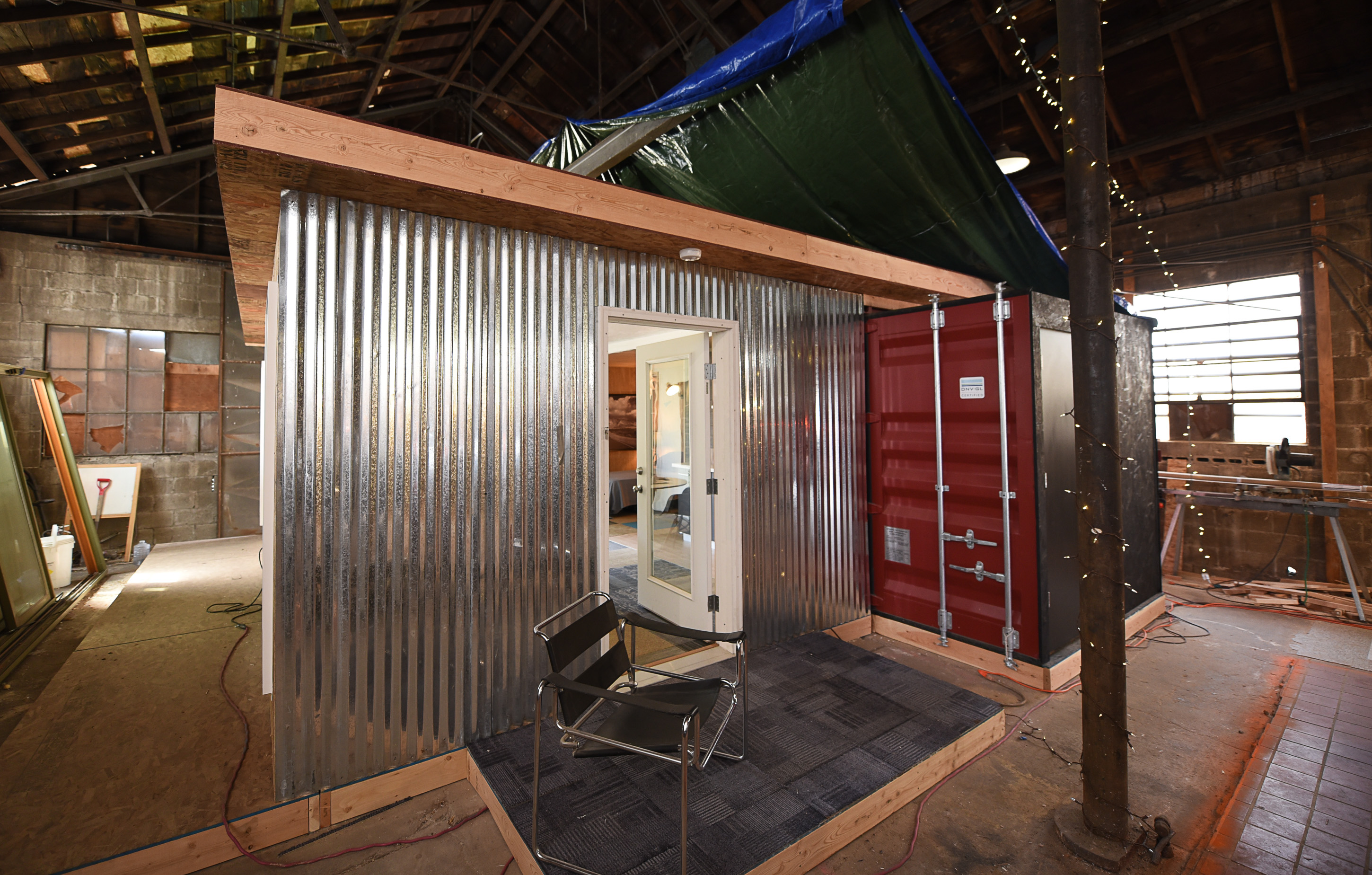 (Francisco Kjolseth | The Salt Lake Tribune) Our Homes, Our Voices, a campaign to bring more attention to the affordable housing crisis across the country showcases one of the solutions being presented by small house specialist Jeff White in Sat Lake City on Wed. May 2, 2018. White has been investing his time now for several years on shipping container prototypes, including a 432 square foot experimental home he built inside a warehouse in Salt Lake that would cost about $36,000 and be easy to assemble on a lot.