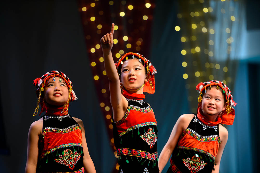 (Trent Nelson | The Salt Lake Tribune) Cynthia Zhang, Sophia Cheng, and Yilan Fu, dancers from Jingjing's Dance Studio, perform at the Chinese New Year Celebration at the County Library's Viridian Event Center in West Jordan, Saturday Feb. 17, 2018.