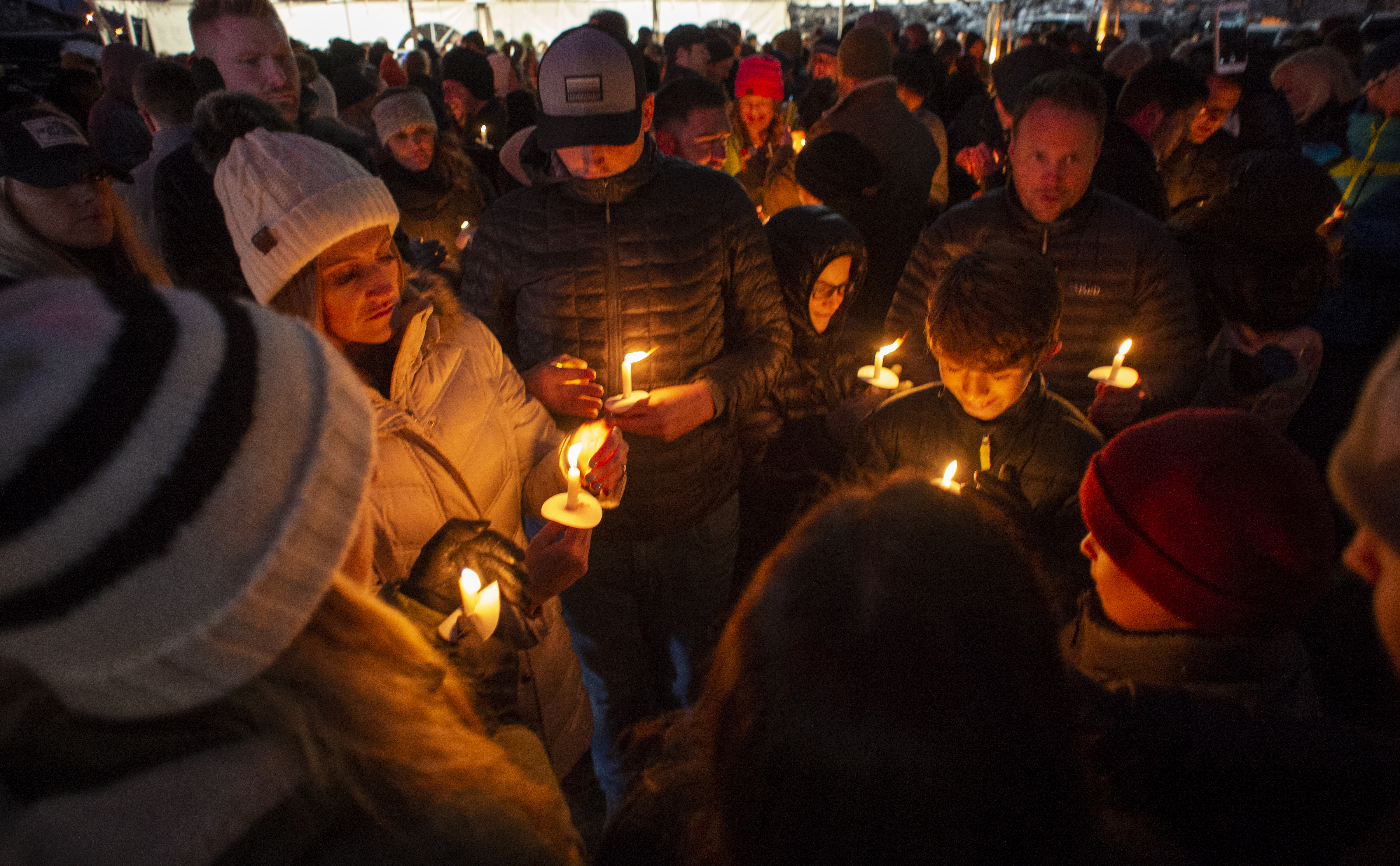 (Rick Egan | The Salt Lake Tribune) Friends and loved ones of David Stokoe gather for a candlelight vigil at the RanLife Home Loans building where he worked in Sandy, Monday, Jan. 21, 2019.