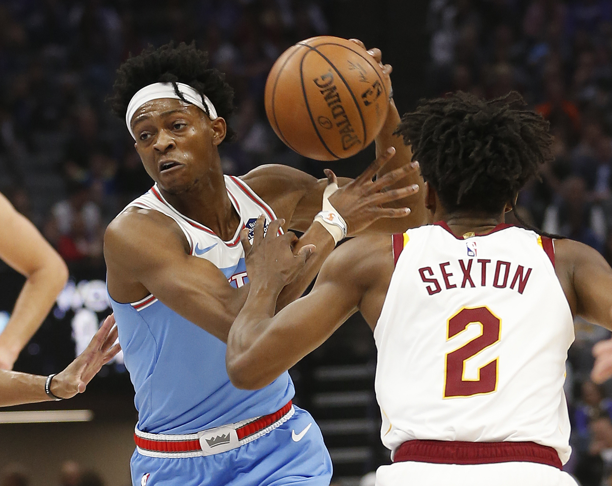 Sacramento Kings guard De'Aaron Fox, left, drives against Cleveland Cavaliers guard Collin Sexton during the first quarter of an NBA basketball game Thursday, April 4, 2019, in Sacramento, Calif. (AP Photo/Rich Pedroncelli)