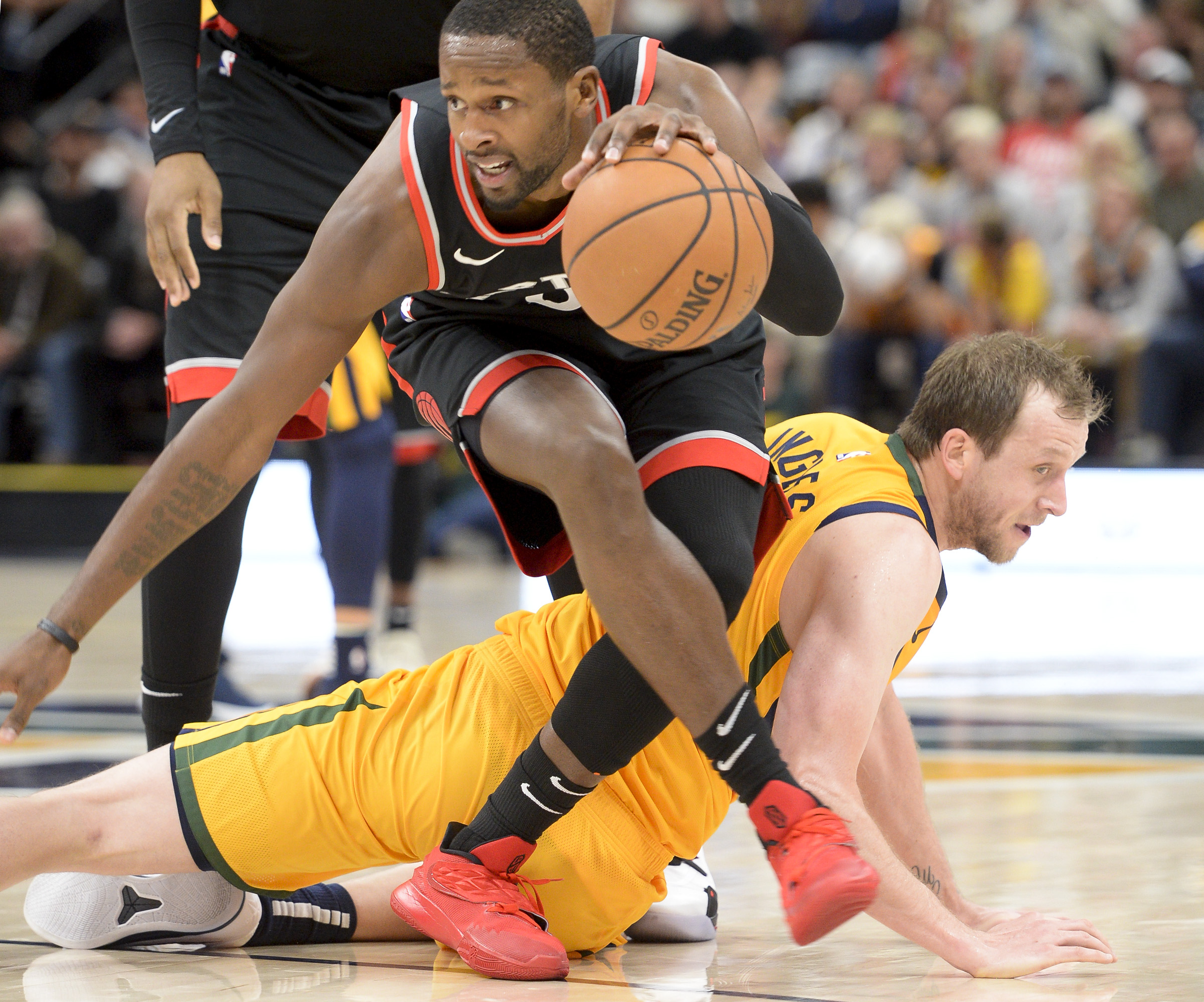 Leah Hogsten | The Salt Lake Tribune Utah Jazz forward Joe Ingles (2) hits the deck trying to stay with Toronto Raptors forward CJ Miles (0) in the second half as the Utah Jazz lose to the Toronto Raptors, 111-124, Monday, Nov. 5, 2018 at Vivant Smart Home Arena.