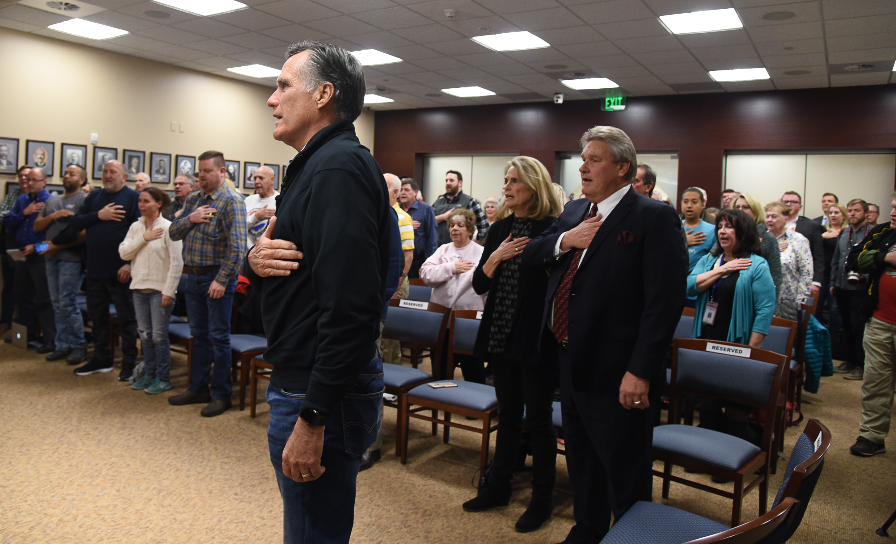 (Francisco Kjolseth | The Salt Lake Tribune) U.S. Senator Mitt Romney does the pledge of allegiance prior to his town hall meeting at the Davis County administration building, Tuesday, January 22, 2019, to hear from local residents.