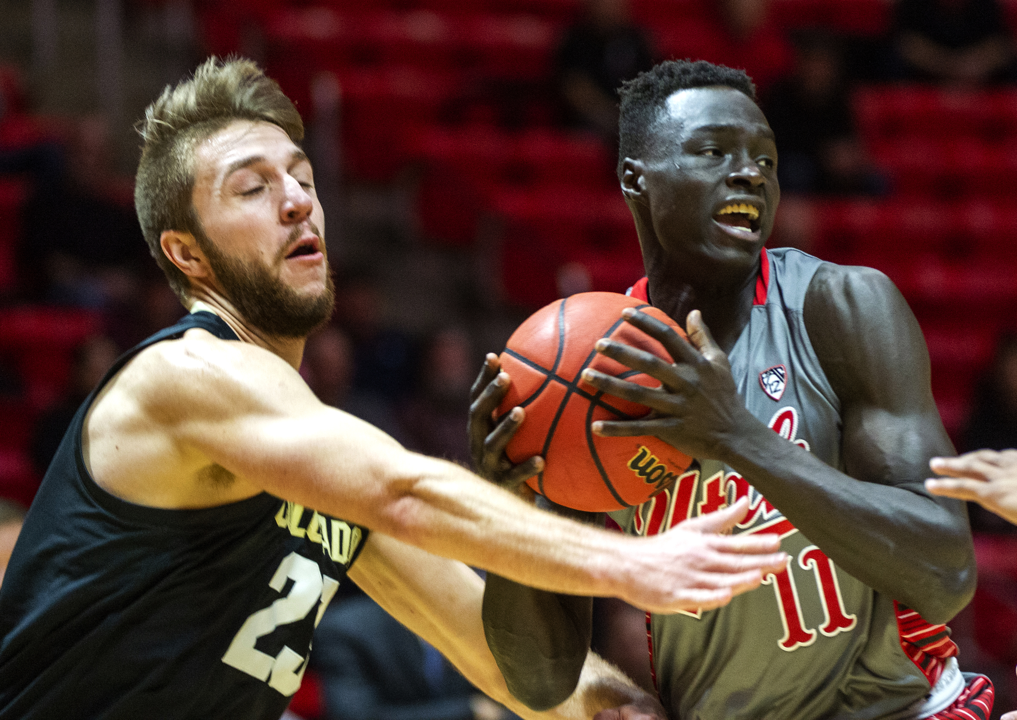 (Rick Egan | The Salt Lake Tribune) Utah Utes forward Both Gach (11) steals the ball from Colorado Buffaloes forward Lucas Siewert (23), in PAC-12 basketball action between the Utah Utes and the Colorado Buffaloes at the Jon M. Huntsman Center, Sunday, Jan. 20, 2019. 