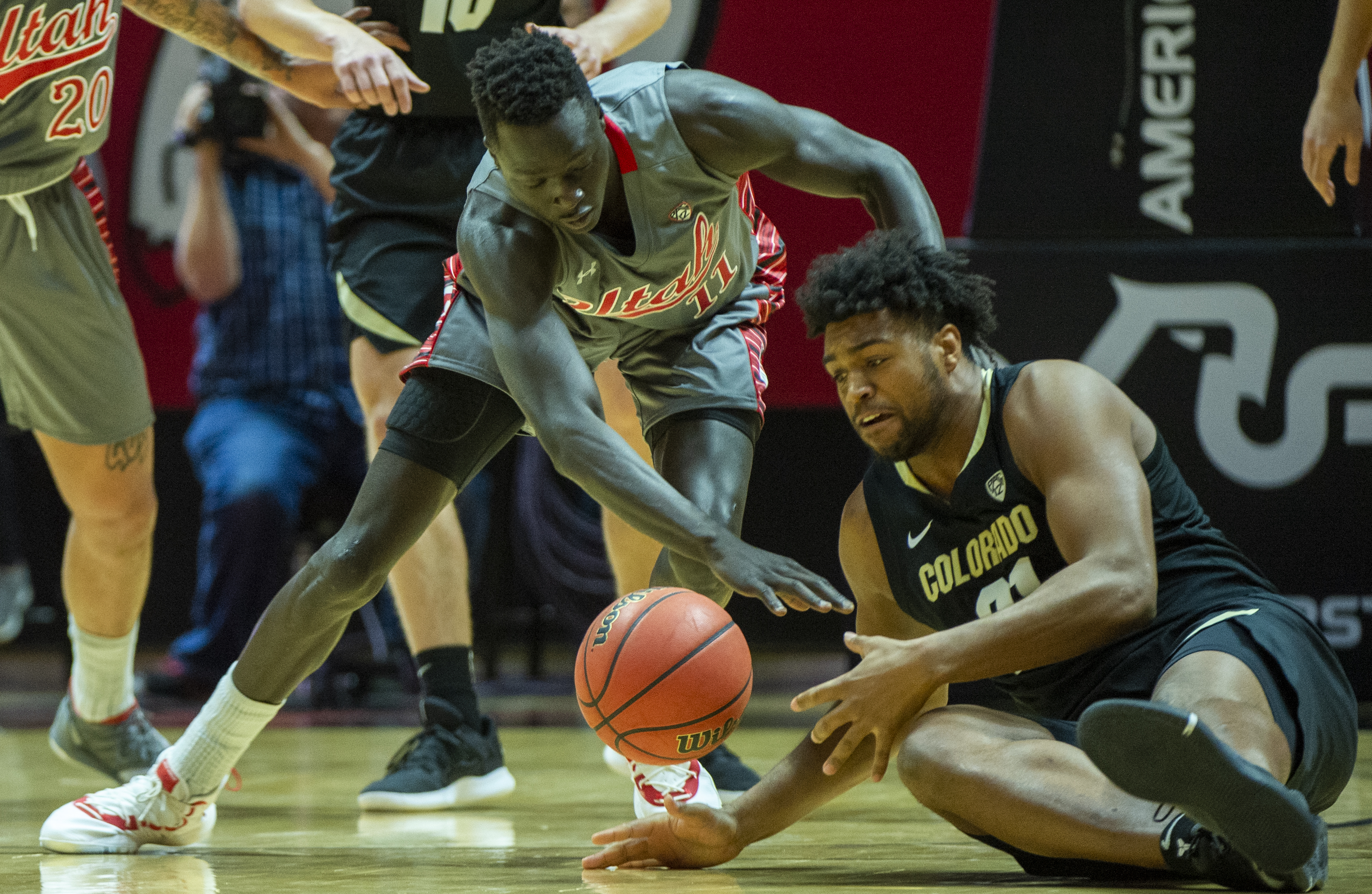 (Rick Egan | The Salt Lake Tribune) Utah Utes forward Both Gach (11) goes for a loose ball along with Colorado Buffaloes forward Evan Battey (21), in PAC-12 basketball action between the Utah Utes and the Colorado Buffaloes at the Jon M. Huntsman Center, Sunday, Jan. 20, 2019. 