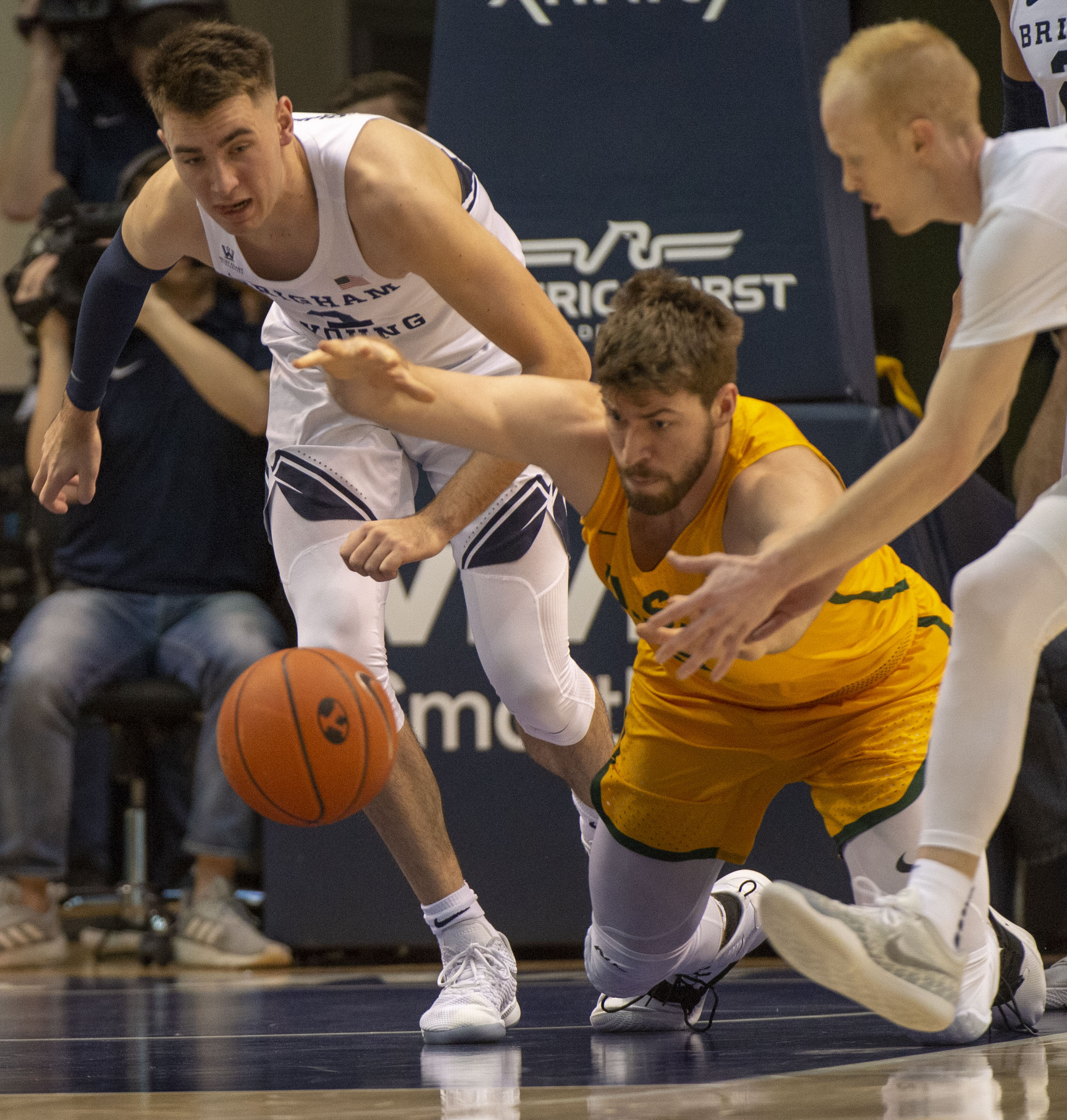 (Rick Egan | The Salt Lake Tribune) Brigham Young Cougars guard Zac Seljaas (2) goes after a loose ball along with San Francisco Dons center Jimbo Lull (5), in WCC basketball action at the Marriott Center, Thursday, February 21, 2018. 