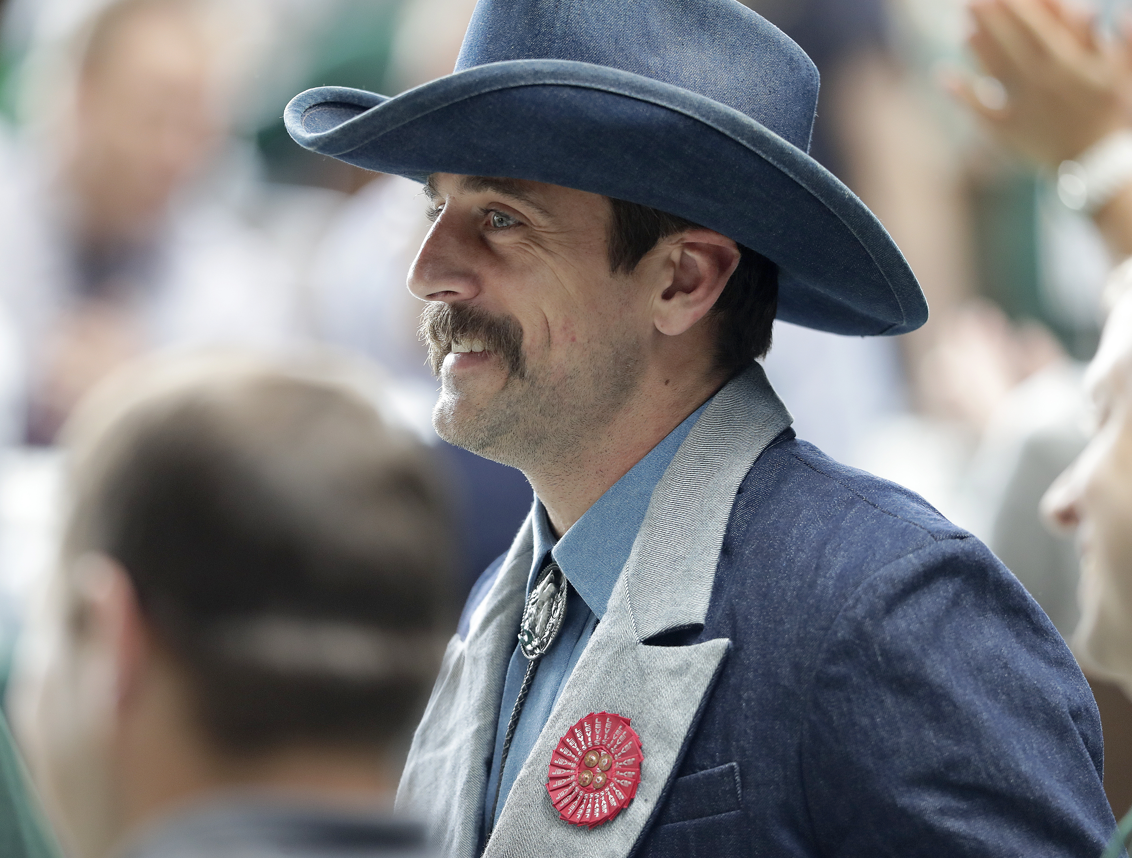 Green Bay Packers quarterback Aaron Rodgers is seen at his table during the Green Bay Chamber of Commerce Welcome Back Packers Luncheon at Lambeau Field Wednesday, Aug. 29, 2018 in Green Bay, Wis. (Jim Matthews/The Post-Crescent via AP)