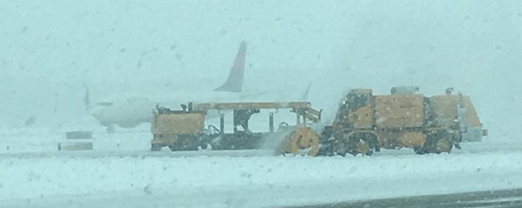 (Photo courtesy Salt Lake International Airport) Crews have been working to clear runways and de-ice planes at Salt Lake International Airport, which has experienced "minor delays" and three flight cancellations.